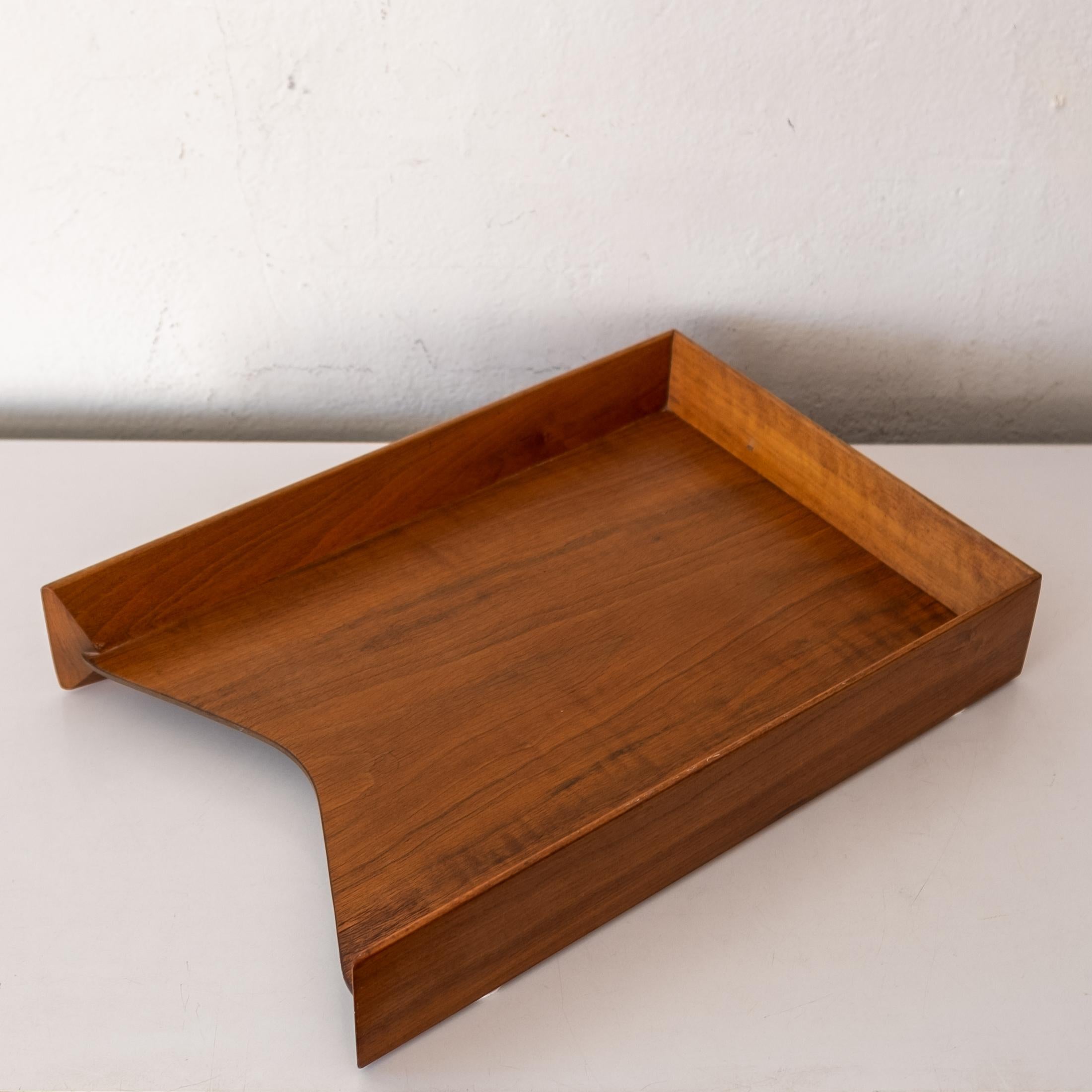 Incredible mid-century letter tray in walnut. Great lines and construction. Has a University of Nebraska inventory tag. Two available.
