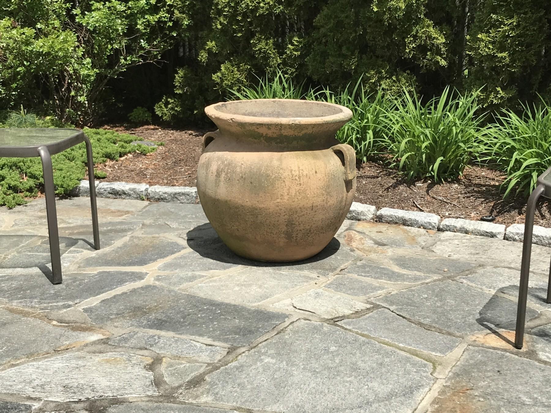 Large but strikingly well-proportioned midcentury terracotta garden urn, neoclassical krater-esque form, elegant belly and charming cupped handles. Desirable patina and just a stunning piece for the lanai, English garden, Italianate Palladio.