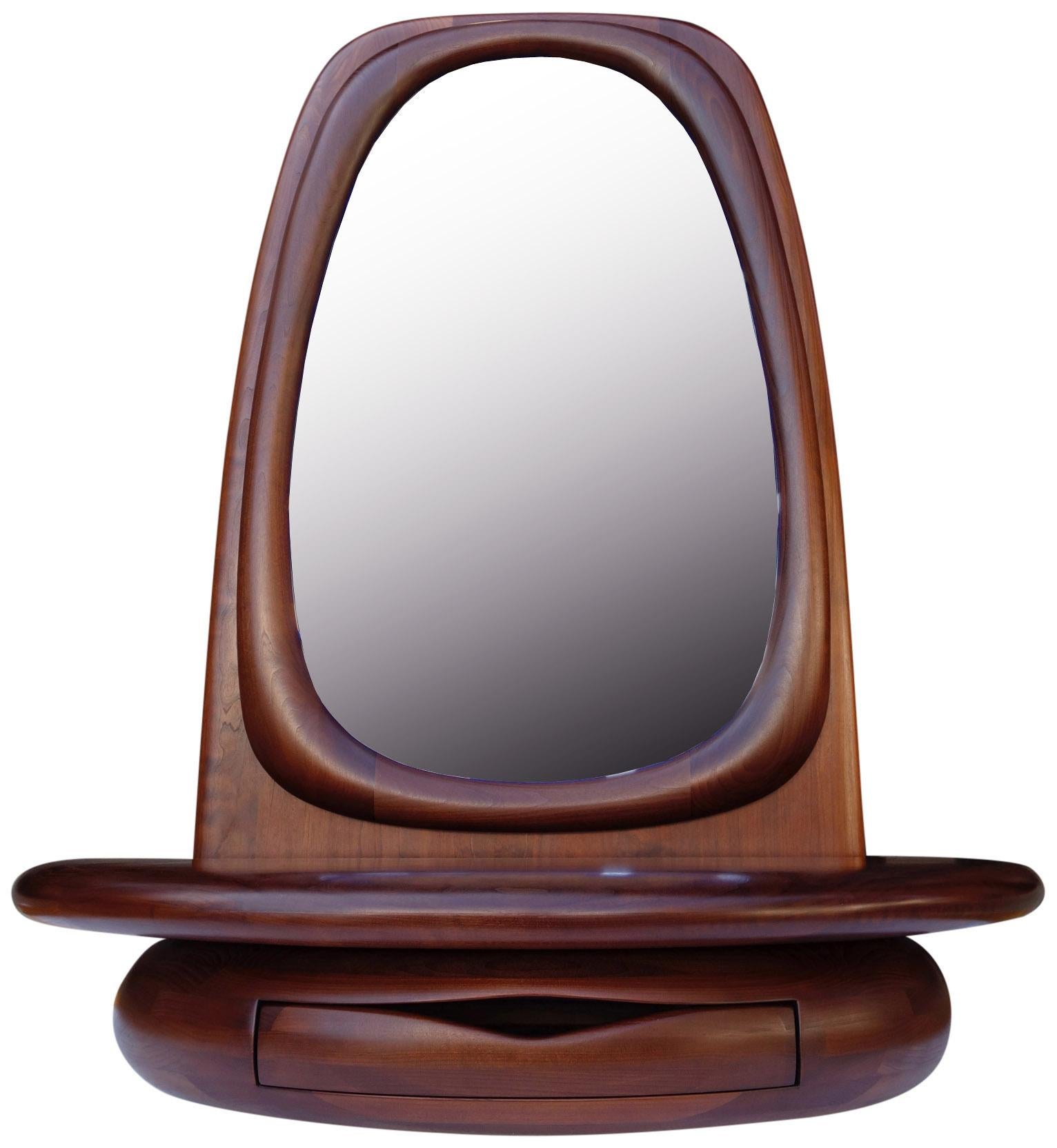 For your consideration is this beautifully sculpted mirror by Dean Santner. Master Craftsman Dean Santner designs are part of the American Modern Craft movement along side Wendell Castle, Nakashima, Phillip Powell to name a few

This hand sculpted