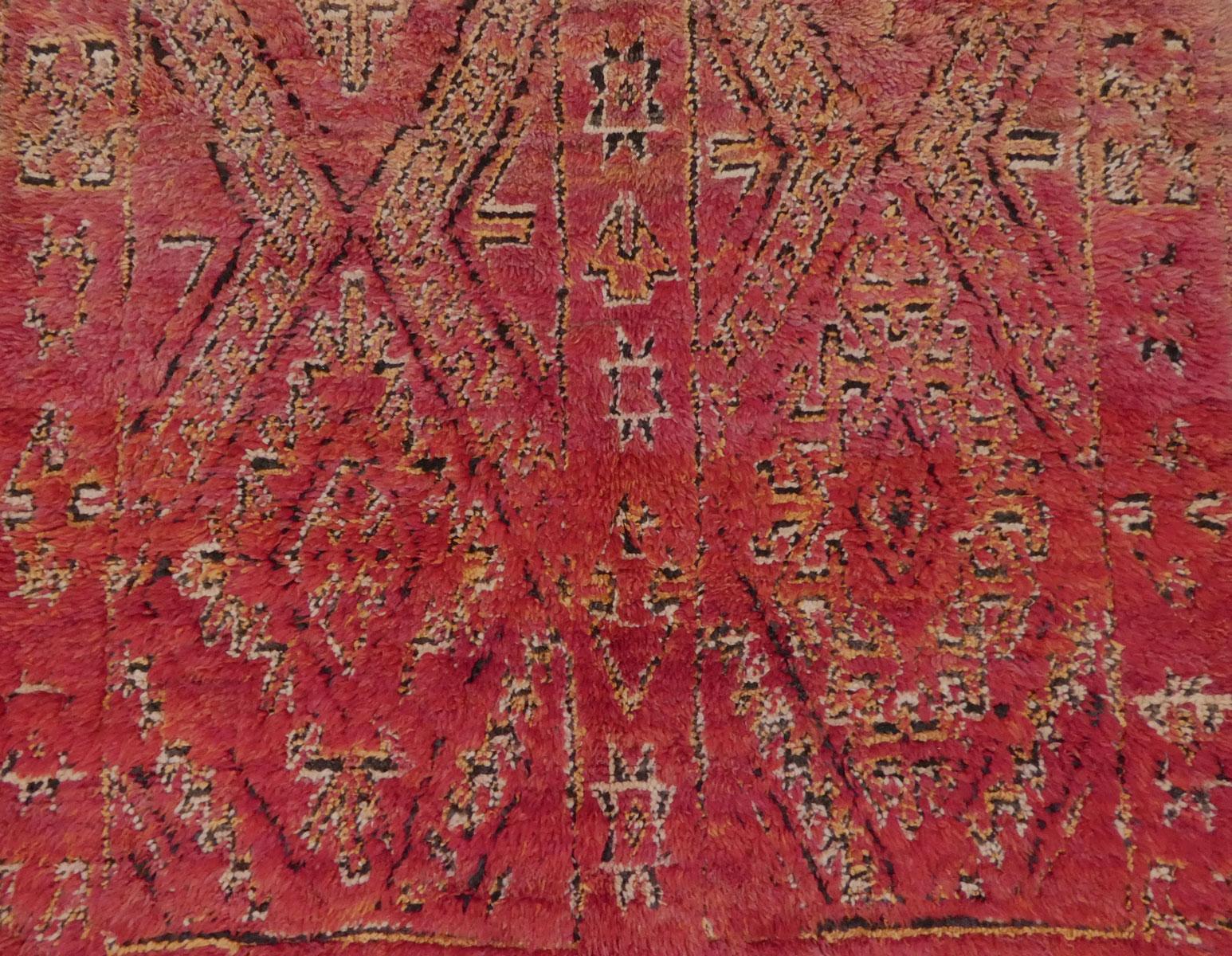 Midcentury Moroccan Beni M'Guild rug handwoven with shades of dark rose, raspberry and garnet wool in a complex Berber shadow pattern. Excellent condition, circa 1970

Dimensions: 6'1 X 9'10

Beni M'Guild rugs are hand-knotted by Berber women from