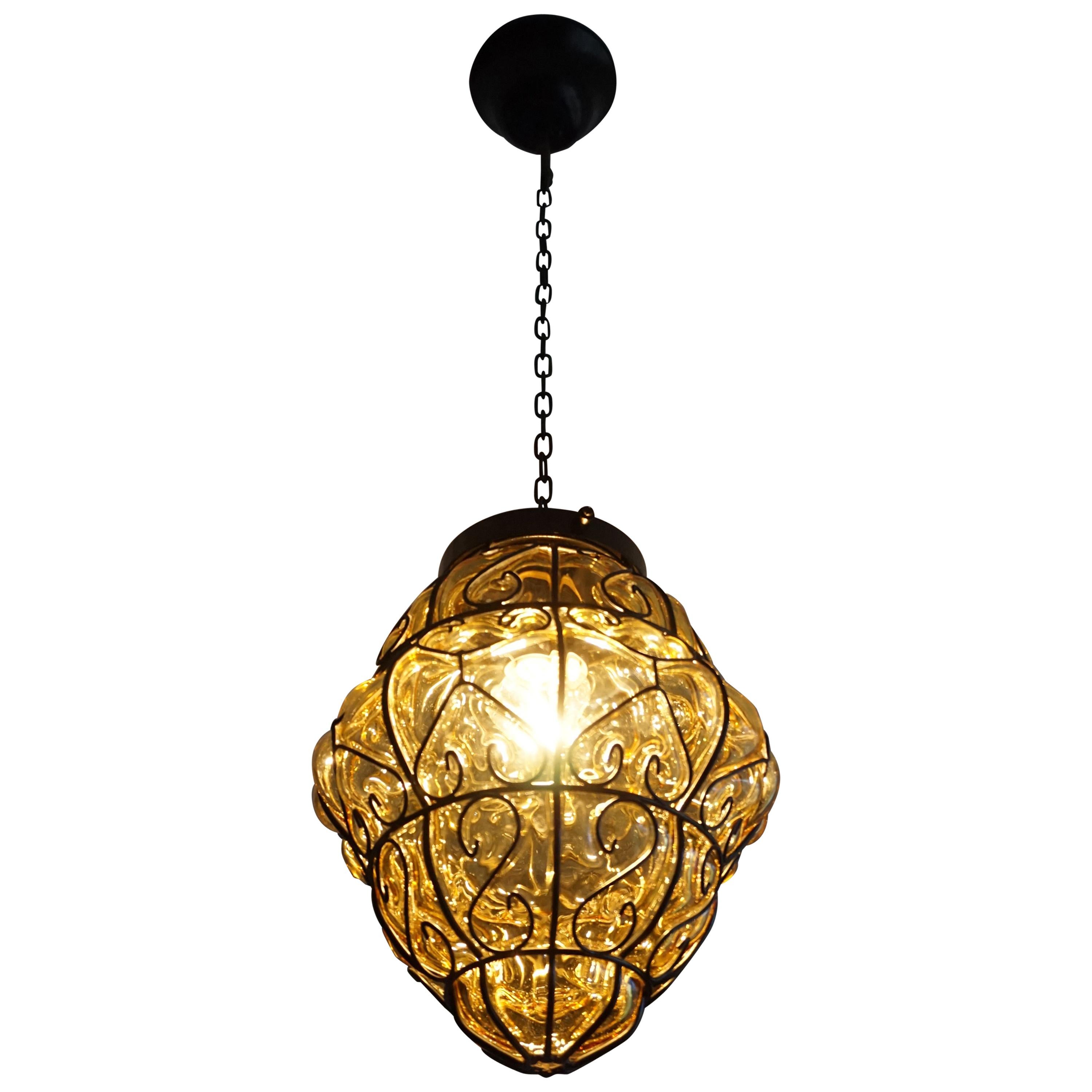 Midcentury Mouth Blown Amber Glass in Wrought Iron Frame Pendant Light Fixture