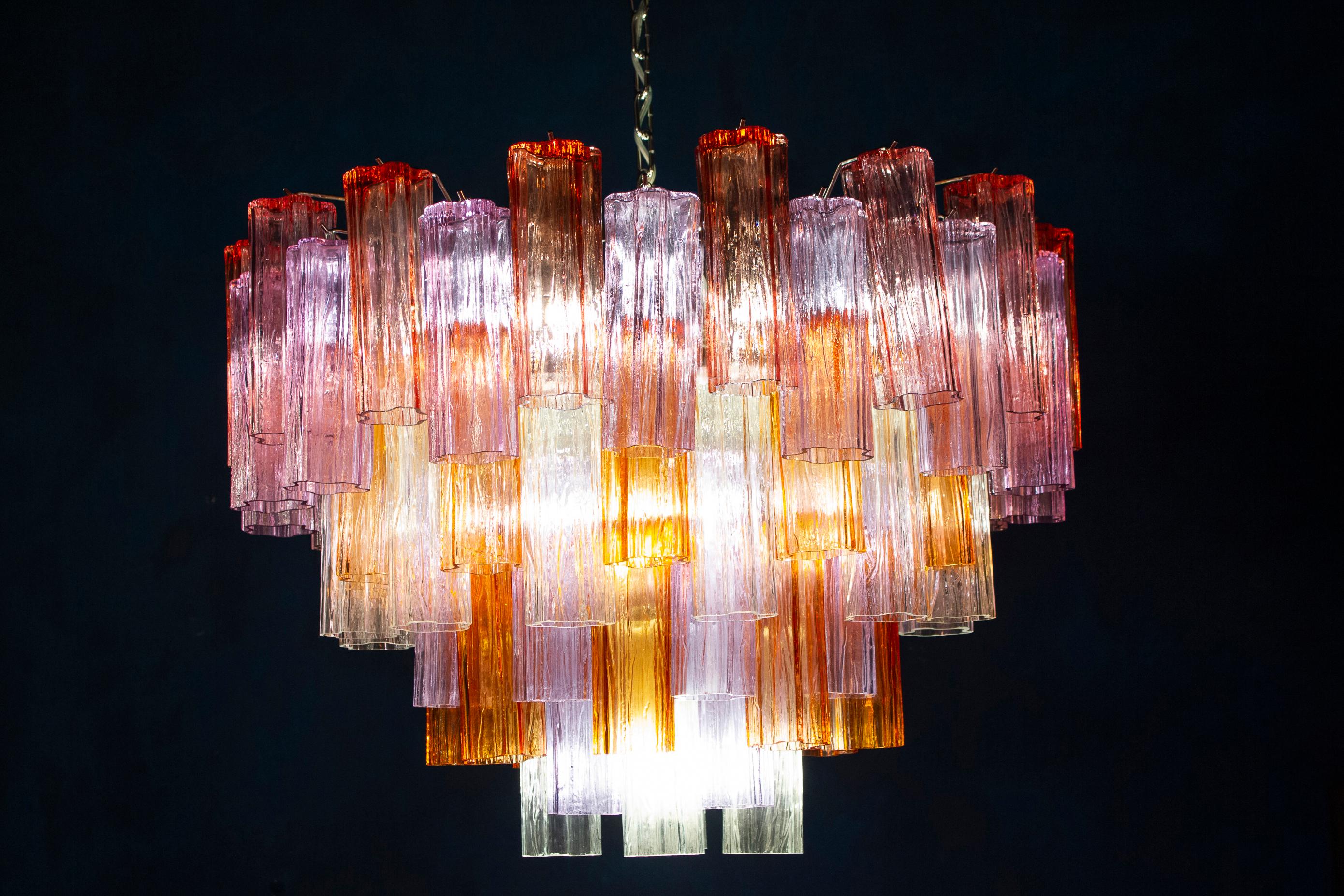 This amazing chandelier with rare color combination considering the uniqueness with amber, pink, amethyst, and ice color precious Murano glasses. Each chandelier with 78 glass blown tronchi elements supported by a chrome frame.
10 E 27 light