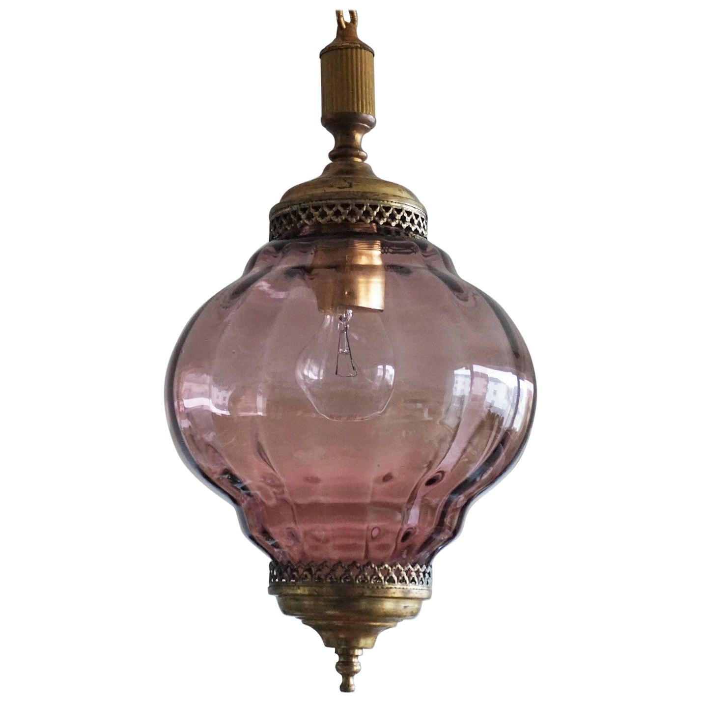 Murano amethyst colored glass pendant or lantern with brass mounts, Italy, 1950s.
It takes one E27 large light bulb.
European wiring: One E27 light bulb socket.
Measures:
Overall height 41