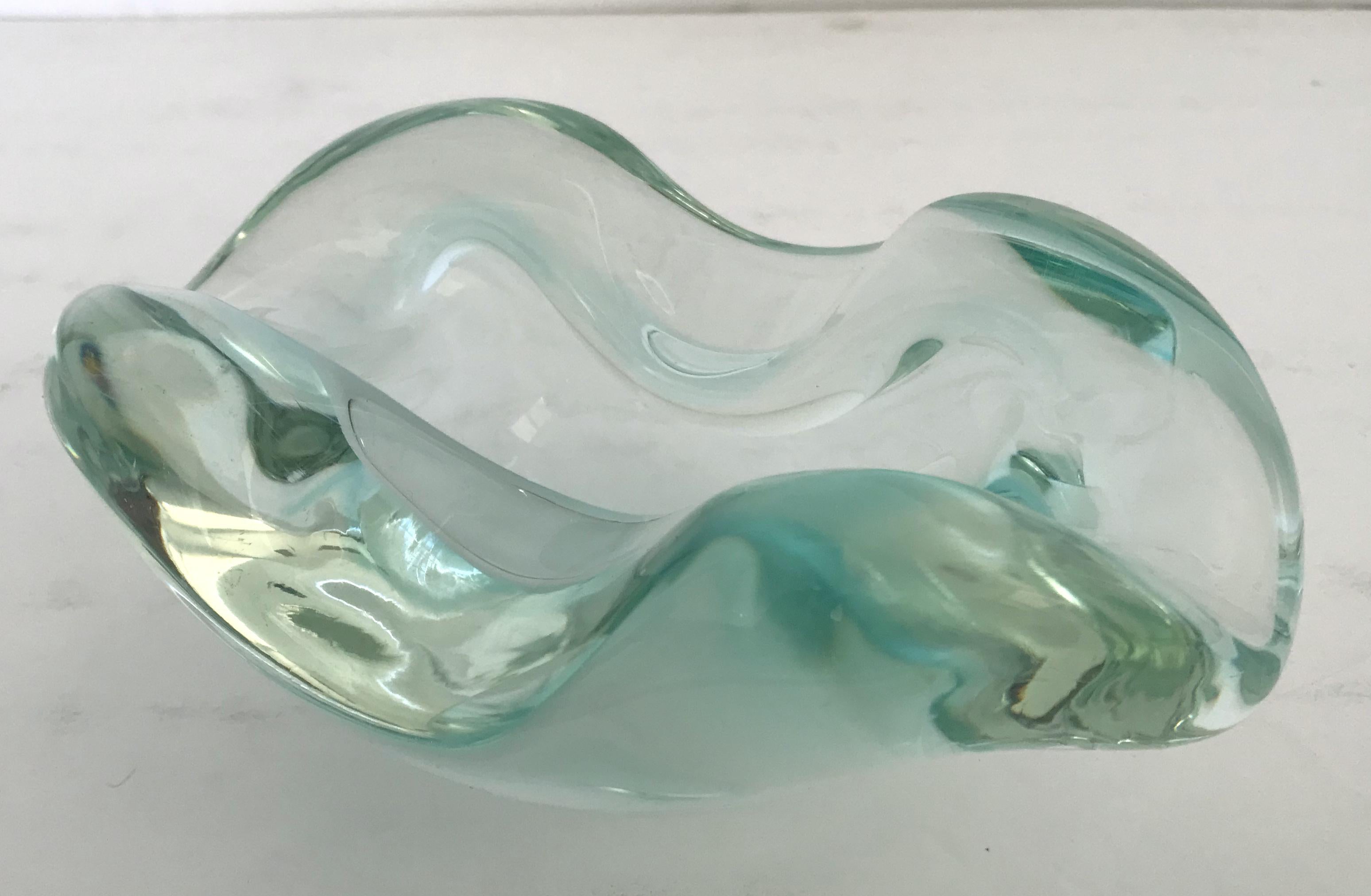 Vintage Italian midcentury clear Murano glass ashtray or bowl hand blown with beautiful curvatures / Made in Italy, circa 1960s
Measures: width 7.5 inches, depth 5 inches, height 3 inches
1 in stock in Los Angeles
Order Reference #: FABIOLTD