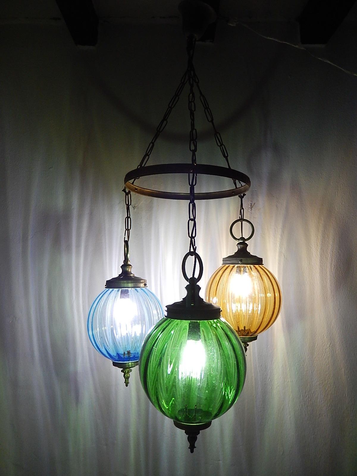 Housing one-light each. Rare blue, yellow and green Murano blown glass globes. Great detailed brass craftsmanship. Will be re-wired with certified appropriate sockets for country and ready to hang. Free priority UPS shipping from Italy, no custom