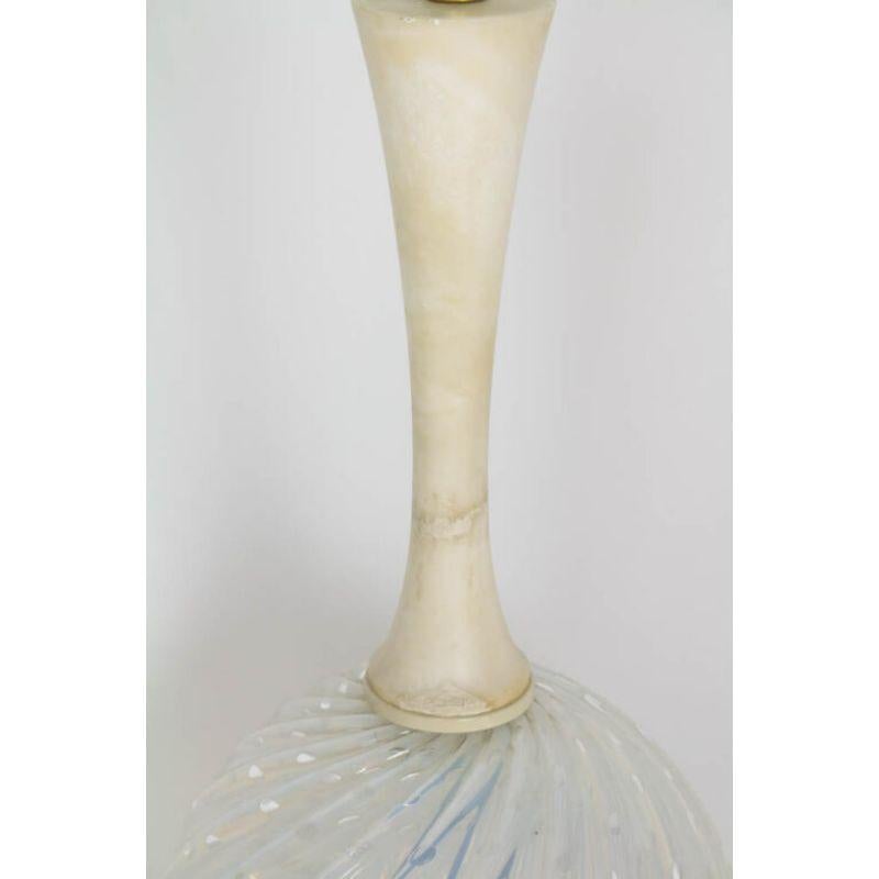 Alabaster, marble and murano glass table lamp. Slender alabaster stem, round blown icy blue blown glass ball atop a marble column base. Glass is swirled with a large bubble pattern. Height is to top of socket only – as the height will vary with the