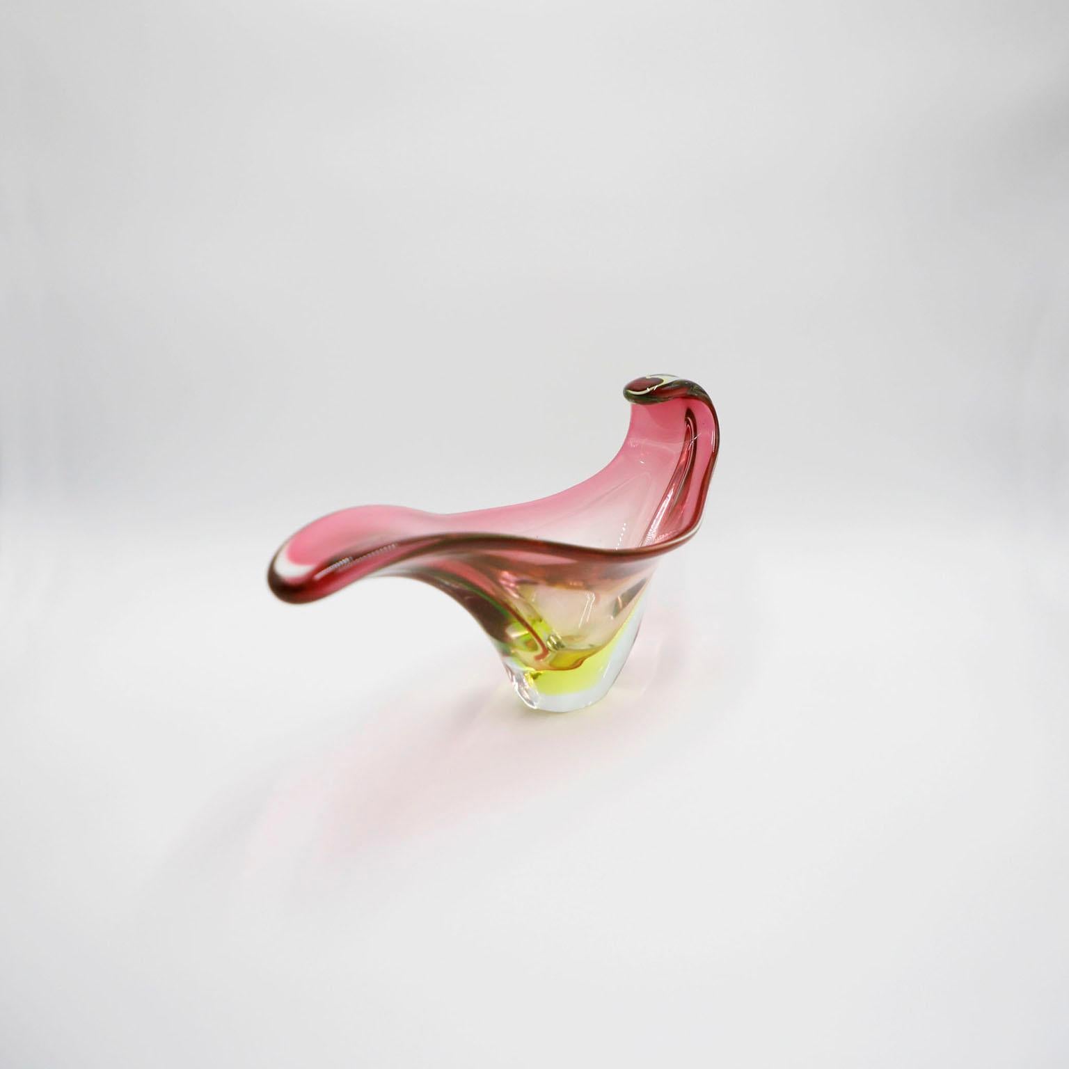 Circa 1960 We offer this rare elegant and vintage hand blown glass centerpiece was created in Italy. The centerpiece is in excellent condition and exhibits wonderful shapes, forms and different shade colorations. This artful is ready to put on a