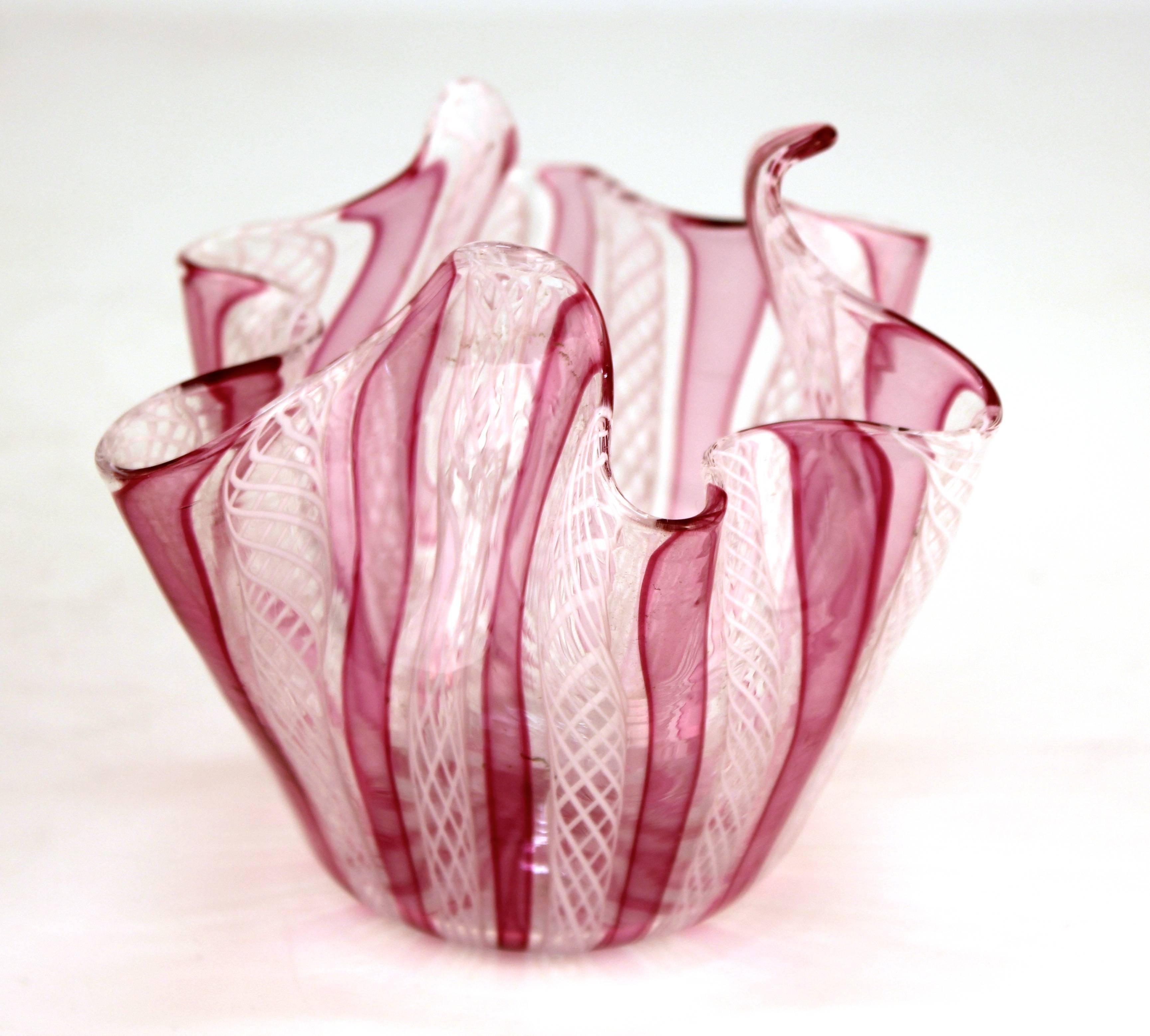 A Mid-Century Modern Murano art glass handkerchief vase in pink and white stripes. The piece was made in Italy and is in good vintage condition.