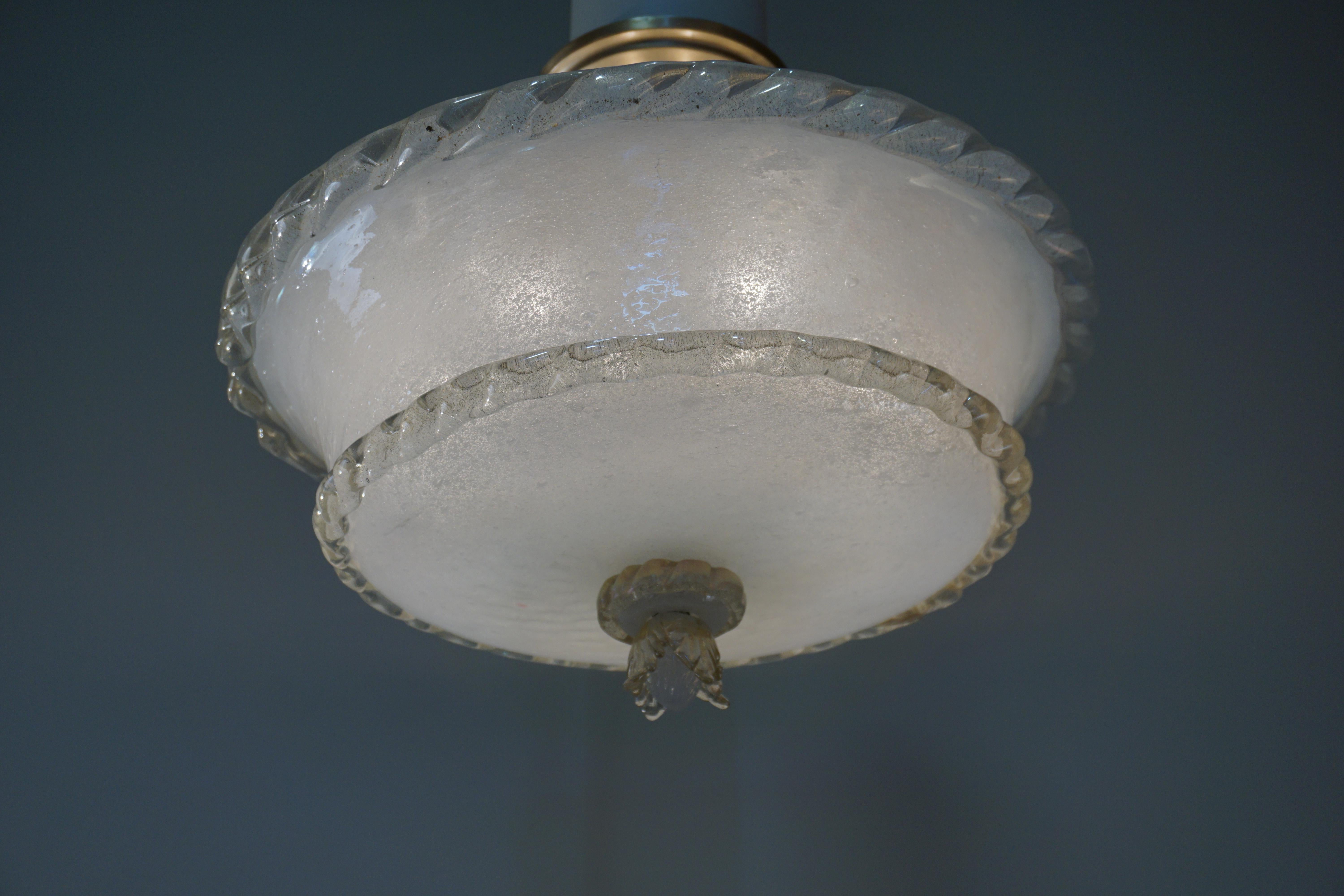A fabulous textured blown glass semi flush chandelier.
Six lights 60 watt each max.
