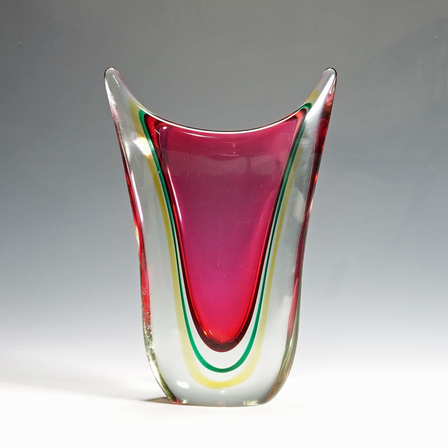 Midcentury Murano sommerso art glass vase by C.O.V.E.M, 1960s

A heavy Murano Sommerso art glass vase manufactured by C.O.V.E.M. (Cooperativa Vetrai Muranesi) circa 1960s. Probably a design of Flavio Poli who worked with C.O.V.E.M. in the 1950s and