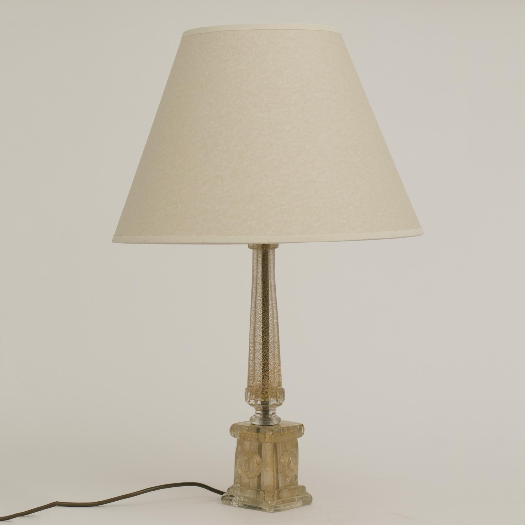 Midcentury Murano table lamp with gold inclusion.
Designed by Barovier & Toso
New replacement shade
Measures: H 63.5cm W 40cm D 40cm
Italy, circa 1960.