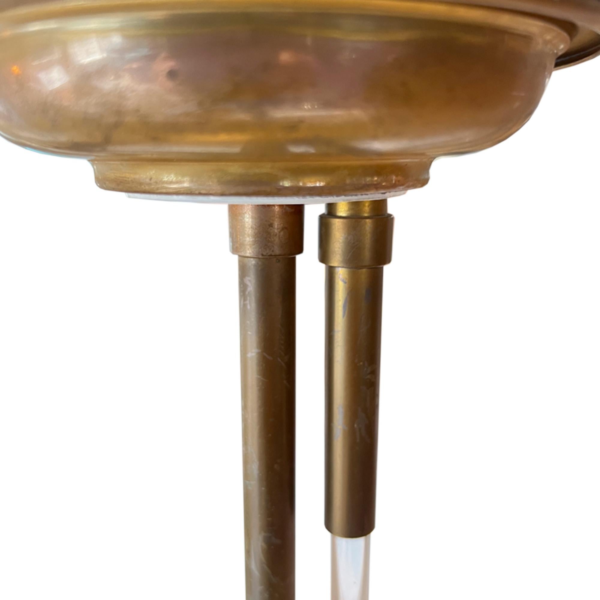 A really attractive 1930s style table lamp.

This light was made by the Mutual Sunset Lamp Company in the 1950s. 

It has a lovely lucite on/off switch operates the light from the main column, by pulling it down. The shade is perforated at the top -