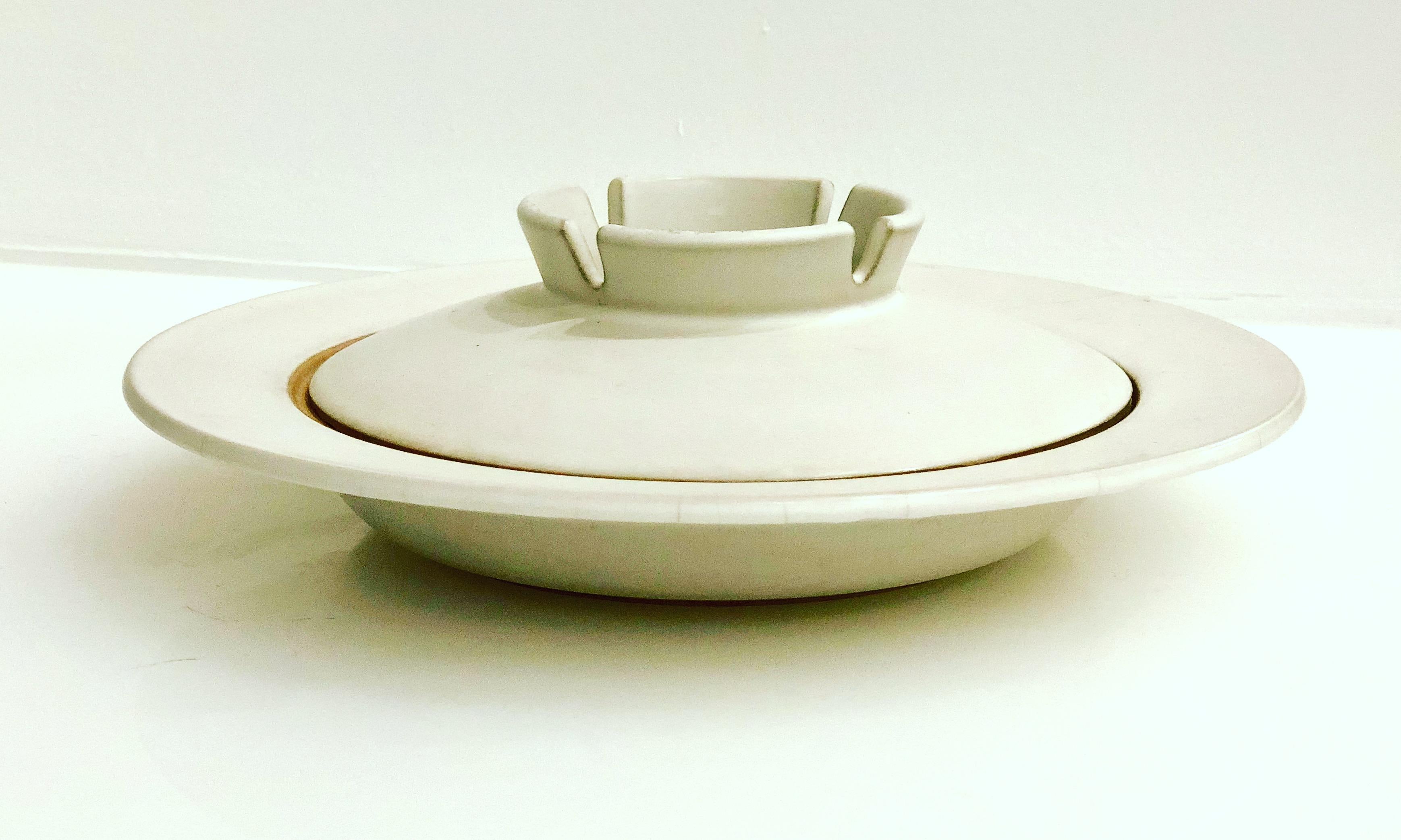A very rare midcentury Nelson stoneware large ceramic ashtray with removable lid. In a crackle finish. handcrafted by Showa. UFO shape, an iconic Classic of the atomic age era.