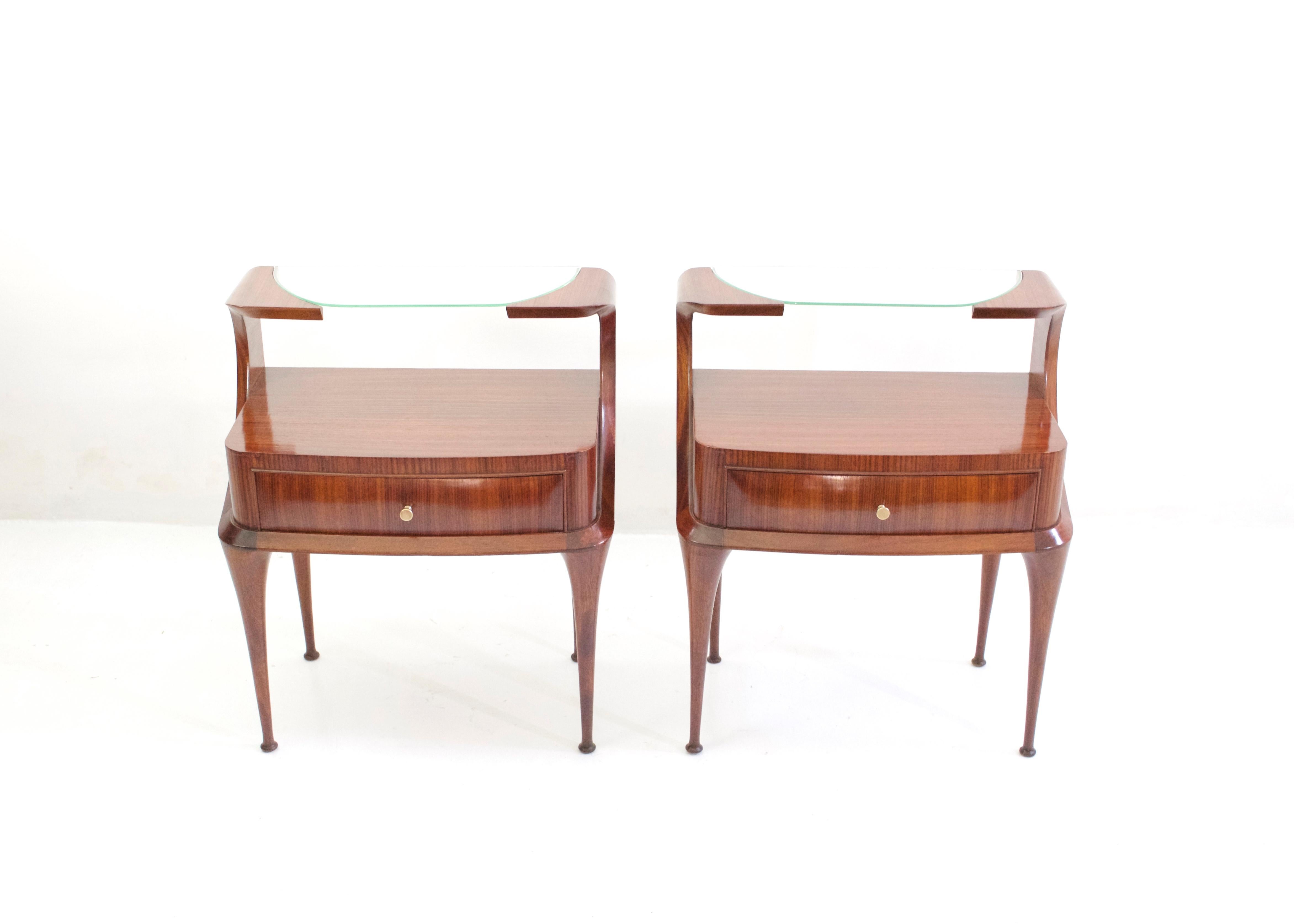A pair of exceptional nightstands by Vittorio Dassi with magnificent attention to details and craftsmanship. These nightstands has a natural grace and lightness about them from the curves and lines almost making them float and would look great with