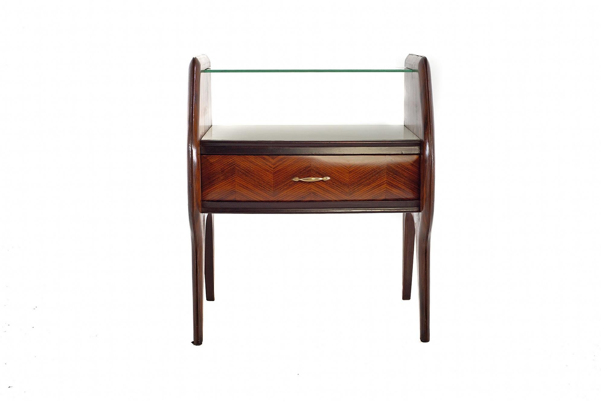 A pair of handmade nightstands by Vittorio Dassi. Each nightstand has a pair of doors with an intricate zigzag design, glass shelf and details in brass. In excellent restored condition.