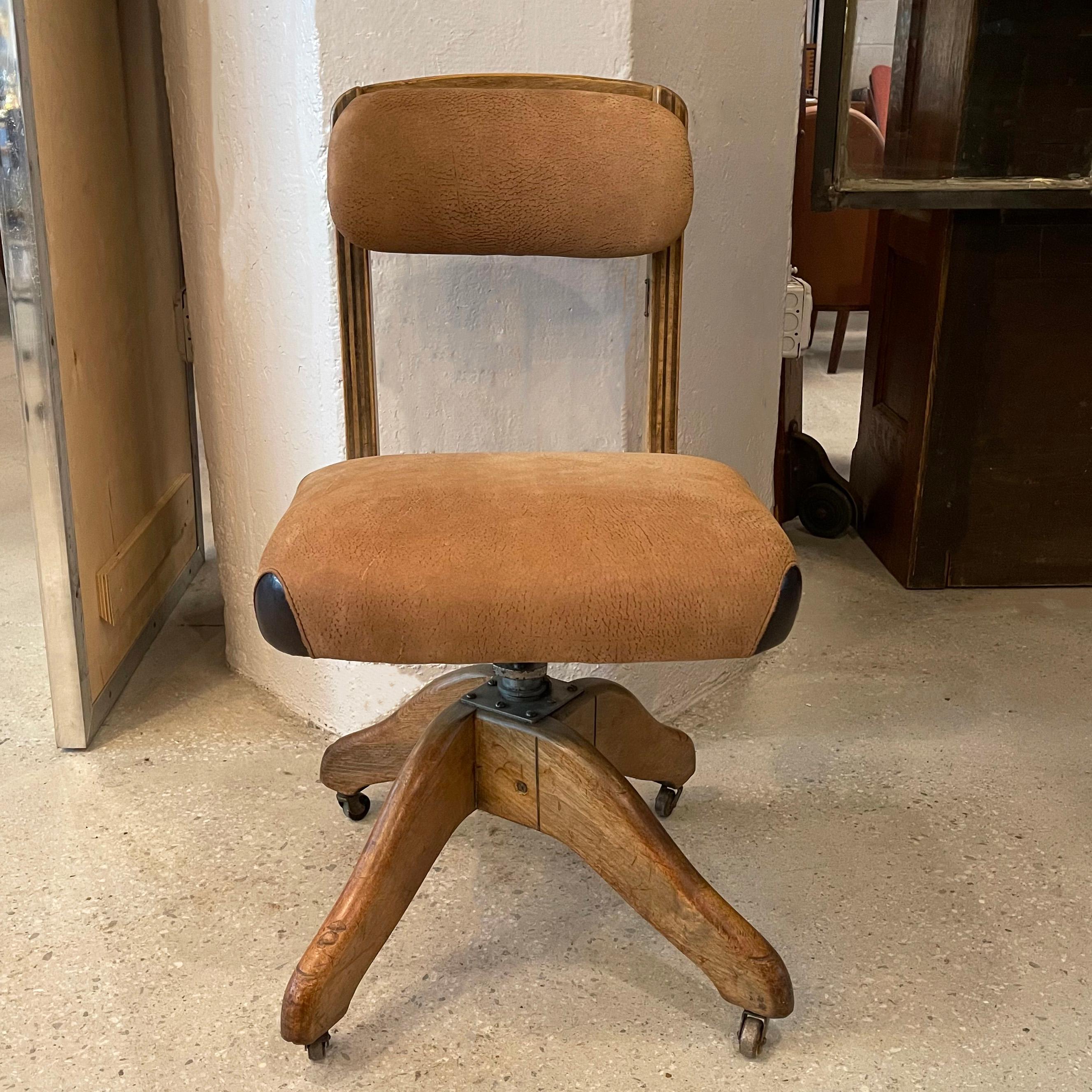 Industrial, midcentury, office desk chair by DoMore Chair Company features a height adjustable 17 - 19 inches, rolling, swivel oak frame with newly upholstered tan suede seat and back edged in contrasting brown leather.