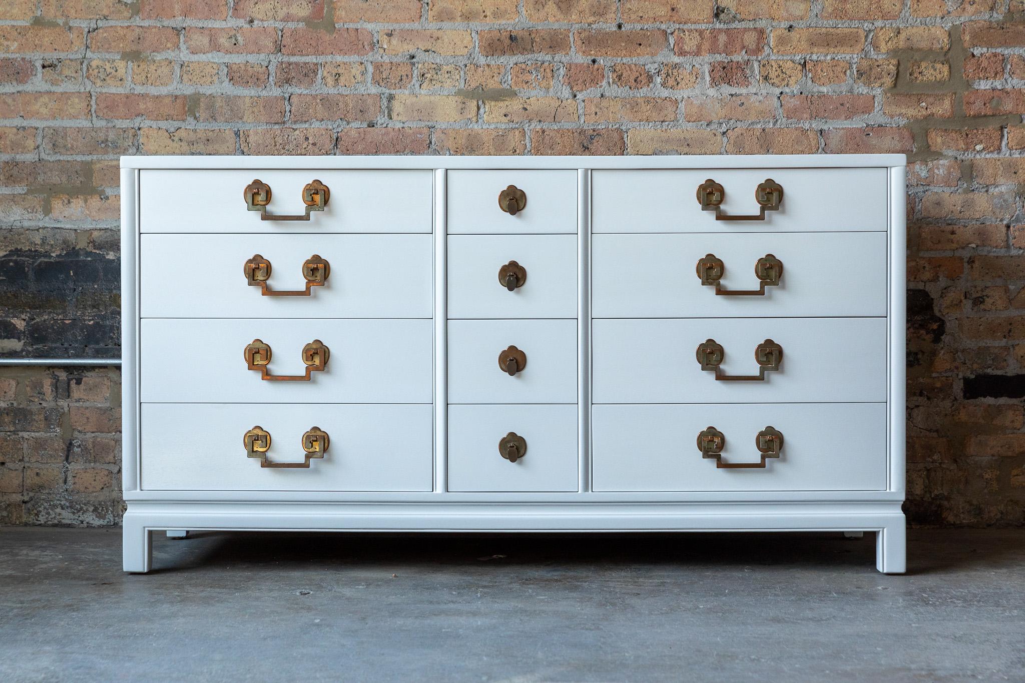Beautiful and rare twelve drawer Landstrom dresser.  Chinoiserie styling, gorgeous copper hardware with great patina.  The bleached mahogany case has been freshly lacquered in a slightly off-white lacquer.  This piece offers an extraordinary amount
