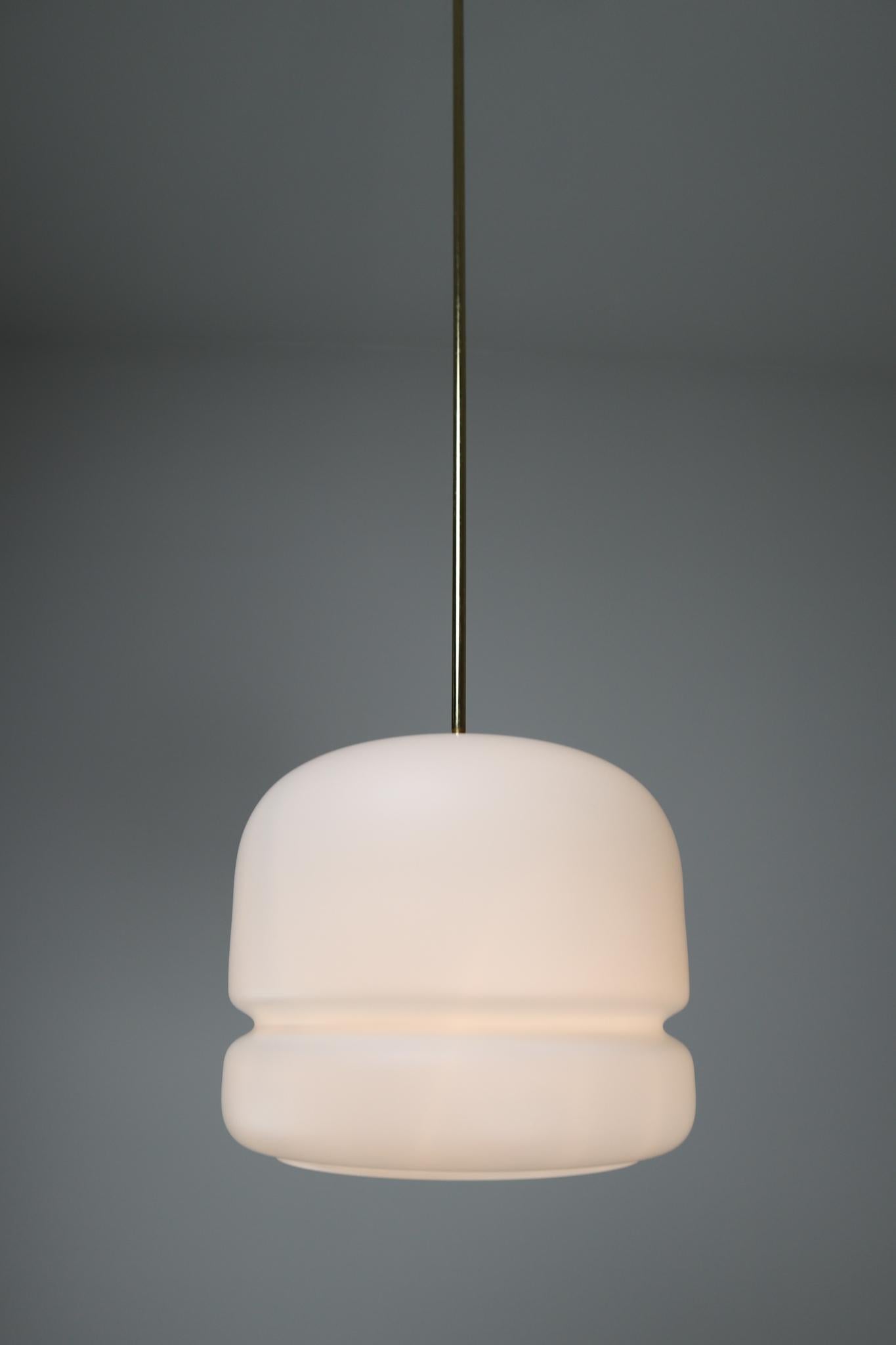 Large set brass-opaline pendants designed and produced in Czech Republic the early 1970. These pendants will create an absolute stunning light partition. These Pendants will contribute to a luxurious character of the interior also this set is a