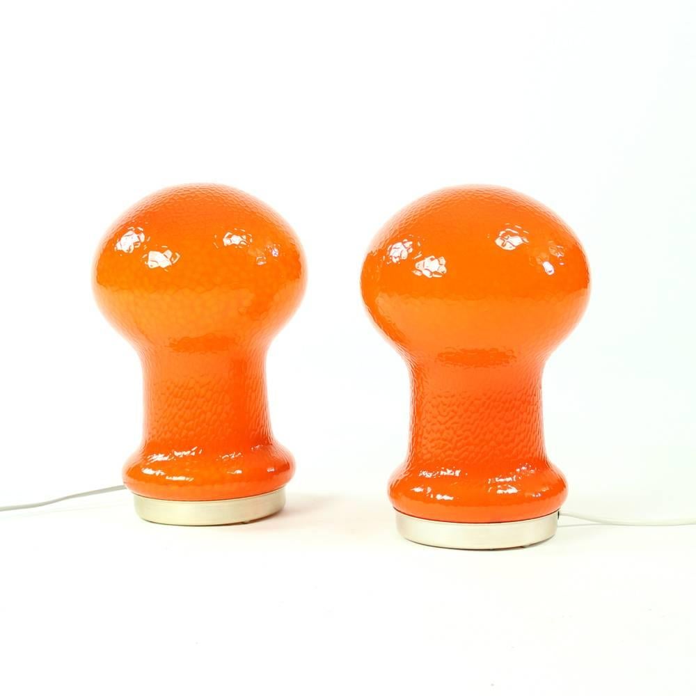 Beautiful and fresh table lamps made in bright orange opaline glass. The lamps Stand on metal ring. Excellent condition without any wear. The glass is structured in leather pattern. Looks really beautiful and gives amazing mood light.