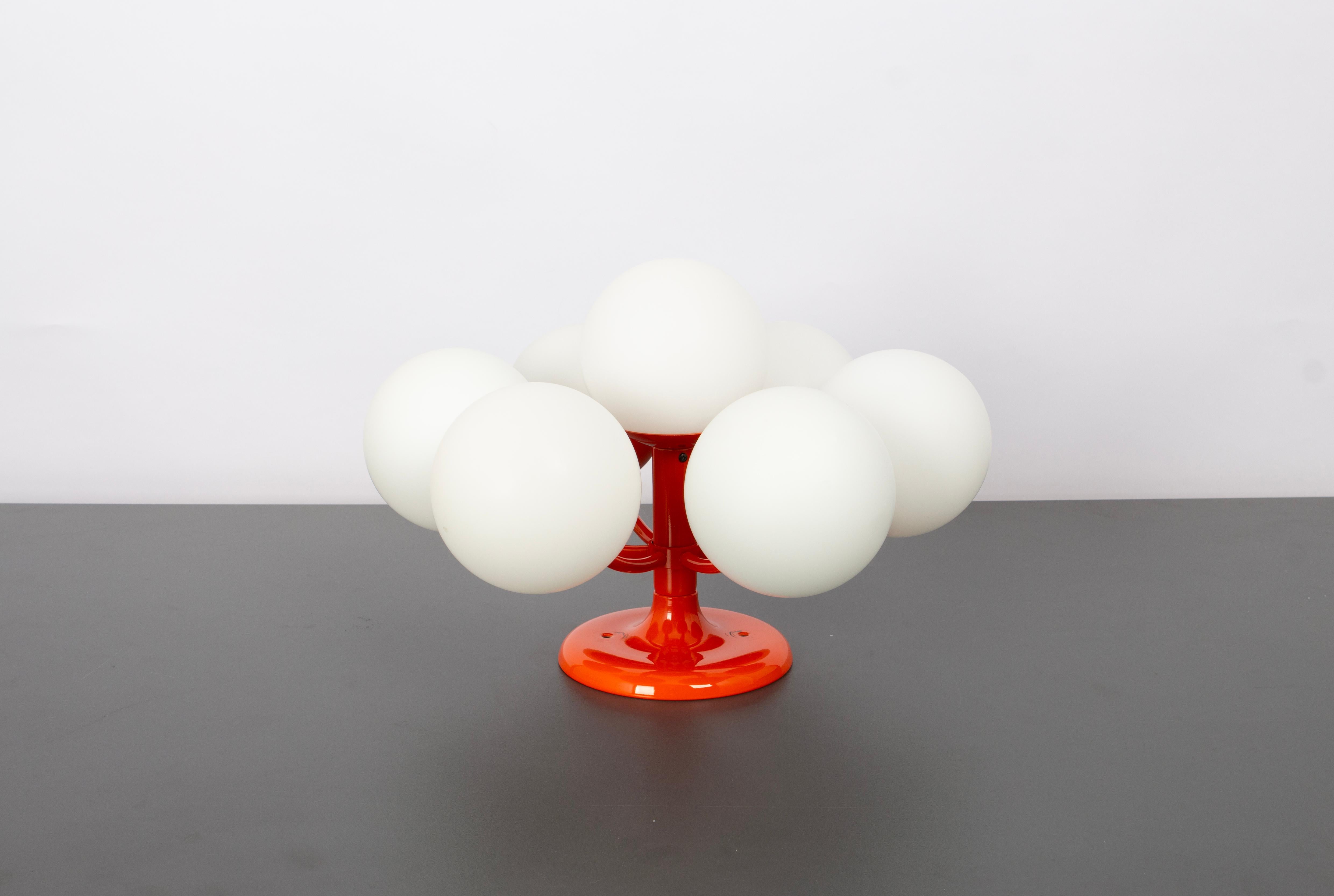 Midcentury vintage ceiling or wall light in orange color made by Kaiser Leuchten, Germany with 6 opal glass balls.
High quality and in very good condition. Cleaned, well-wired, and ready to use. 

The fixture requires 6 x E14 small bulbs with 40W