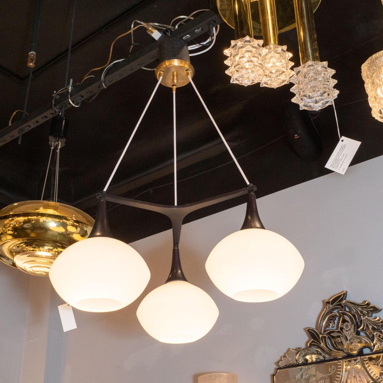 Midcentury Organic Modern Three Arm Ebonized Walnut And Milk Glass This Sophisticated And Graphic Chandelier Was Realized In Sweden Circa 1950 It Features Three