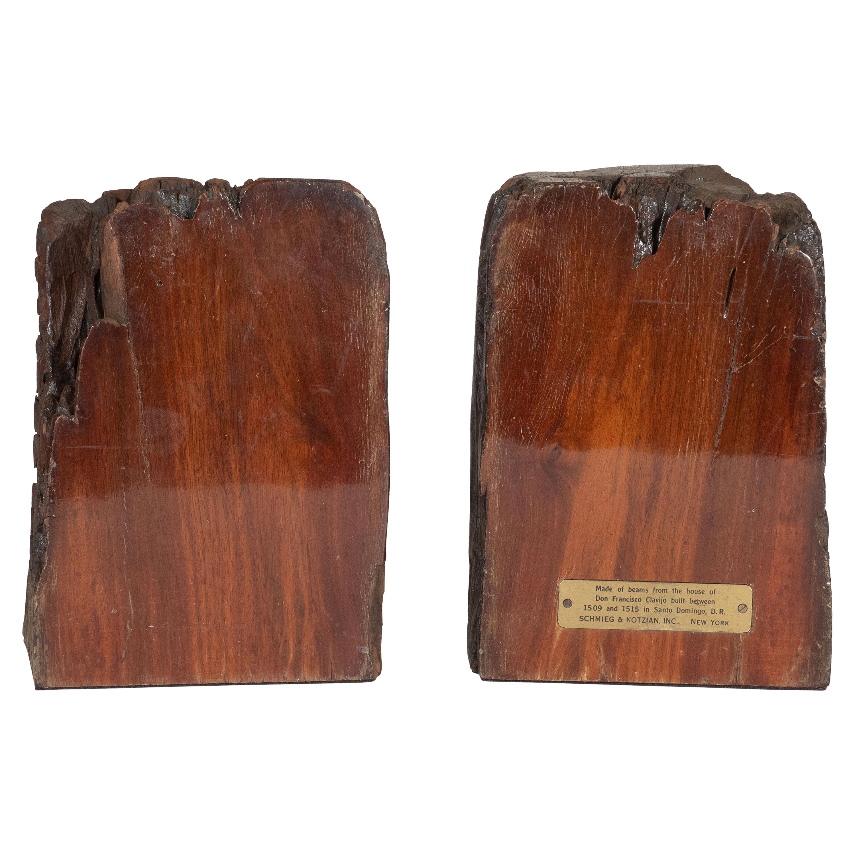 This elegant pair of midcentury organic modern book ends were realized by the esteemed company Schmieg & Kotzian in the United States, circa 1950. The book ends were repurposed caobo (tropical mahogany) wood beams extracted from the house of Don