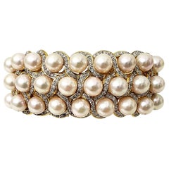 Bracelet jonc de luxe du milieu du siècle dernier, fabriqué à la main en or 18 carats avec diamants et perles