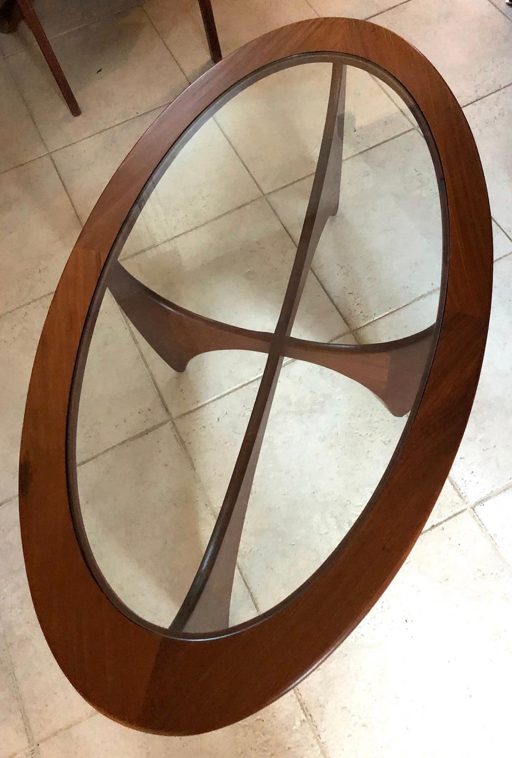 Midcentury oval Astro teak coffee table with glass top by G-Plan, 1960s
A beautiful sculptural coffee table designed by Victor Wilkins and manufactured 
by G Plan during the 1960s in England.
In great condition, table has recently been restored