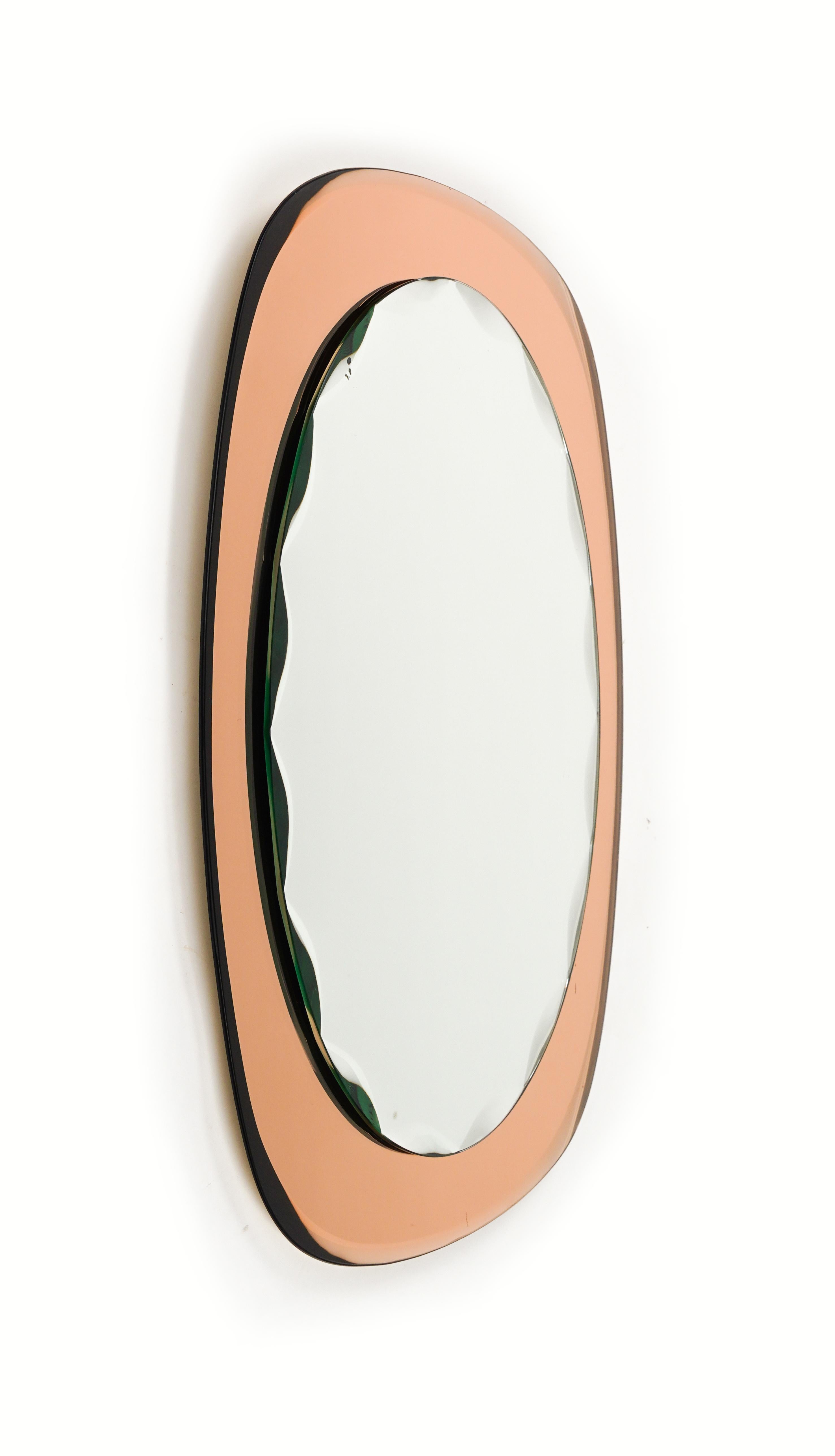 
Midcentury amazing scalloped oval wall mirror on rose gold mirror frame attributed to Cristal Arte.

Made in Italy in the 1960s.

The mirror is very well-made, heavy and in good vintage condition. 
