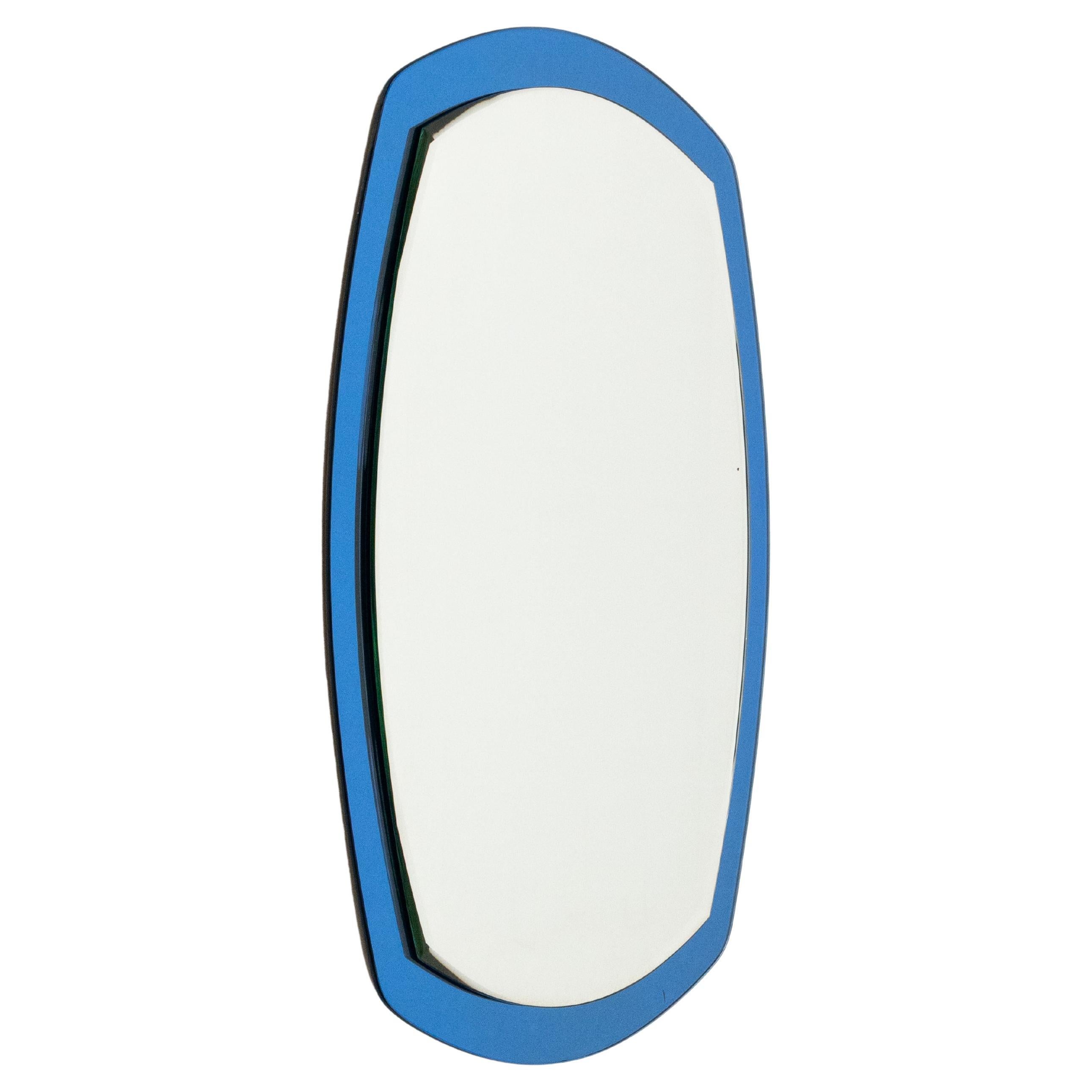Miroir mural ovale du milieu du siècle avec cadre bleu par Lupi Cristal Luxor, Italie, années 1960 en vente