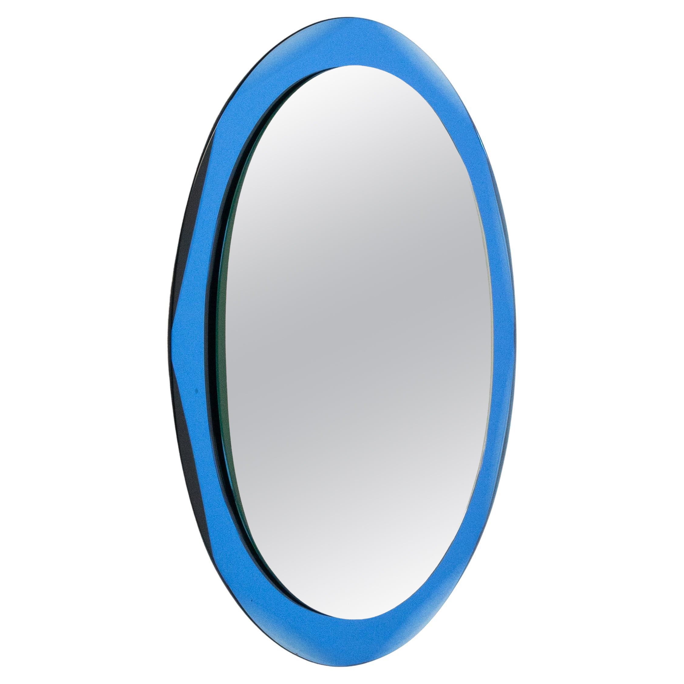 Specchio da parete ovale del Medioevo con cornice blu in stile Cristal Arte, Italia anni '60