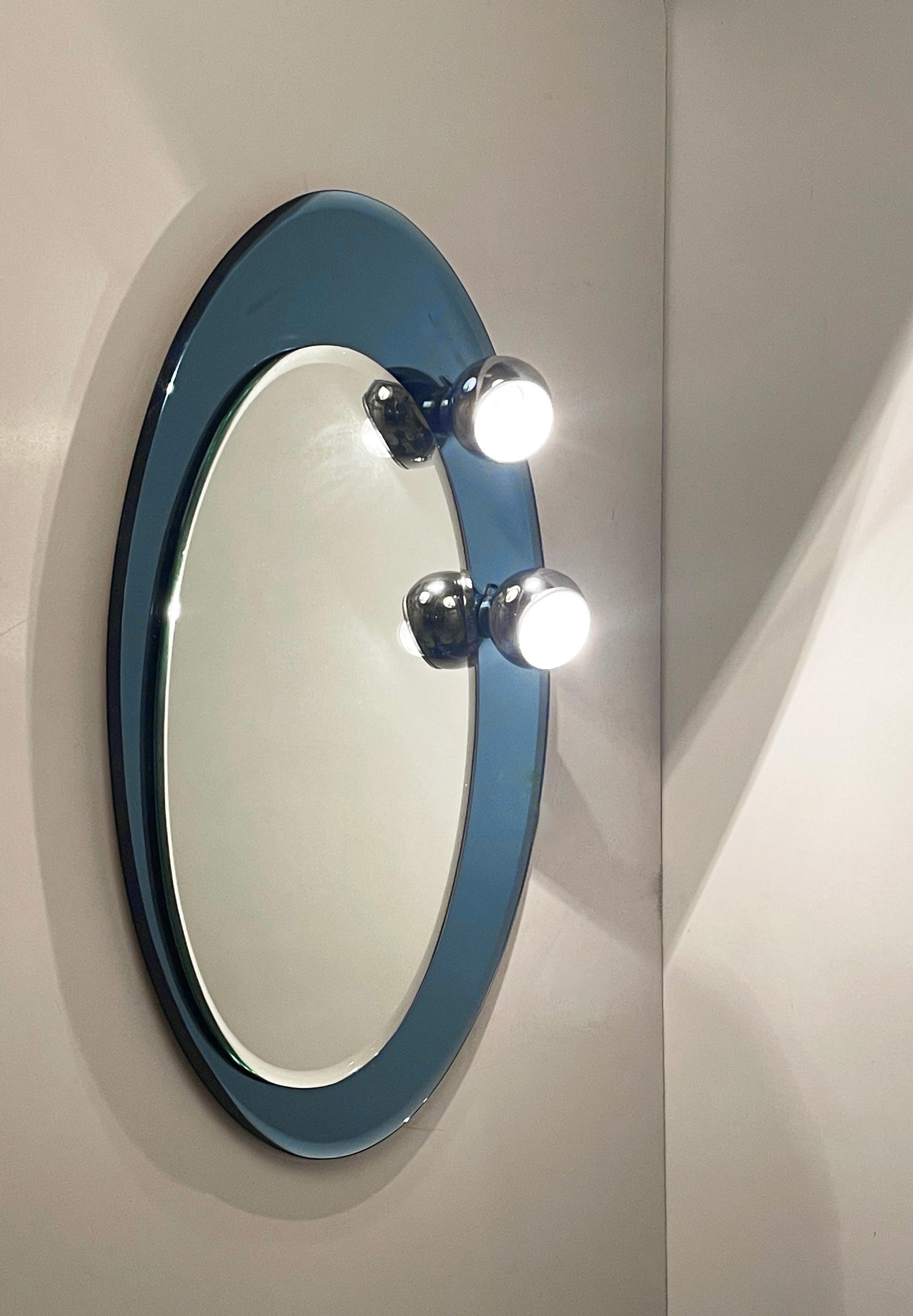 Italian Midcentury Oval Wall Mirror with Blue Glass Frame and Magnetic Lights Italy 1960 For Sale