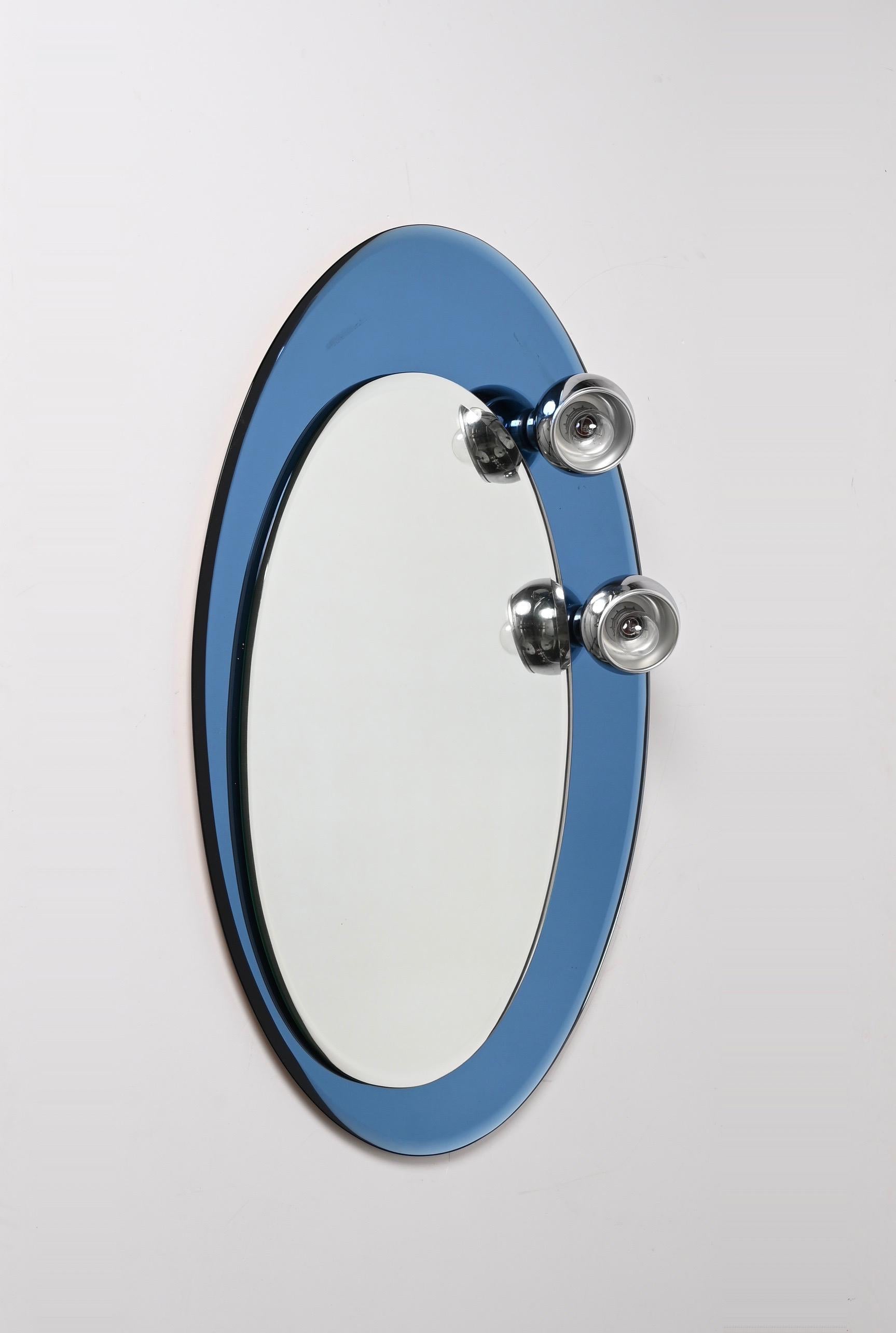20th Century Midcentury Oval Wall Mirror with Blue Glass Frame and Magnetic Lights Italy 1960 For Sale