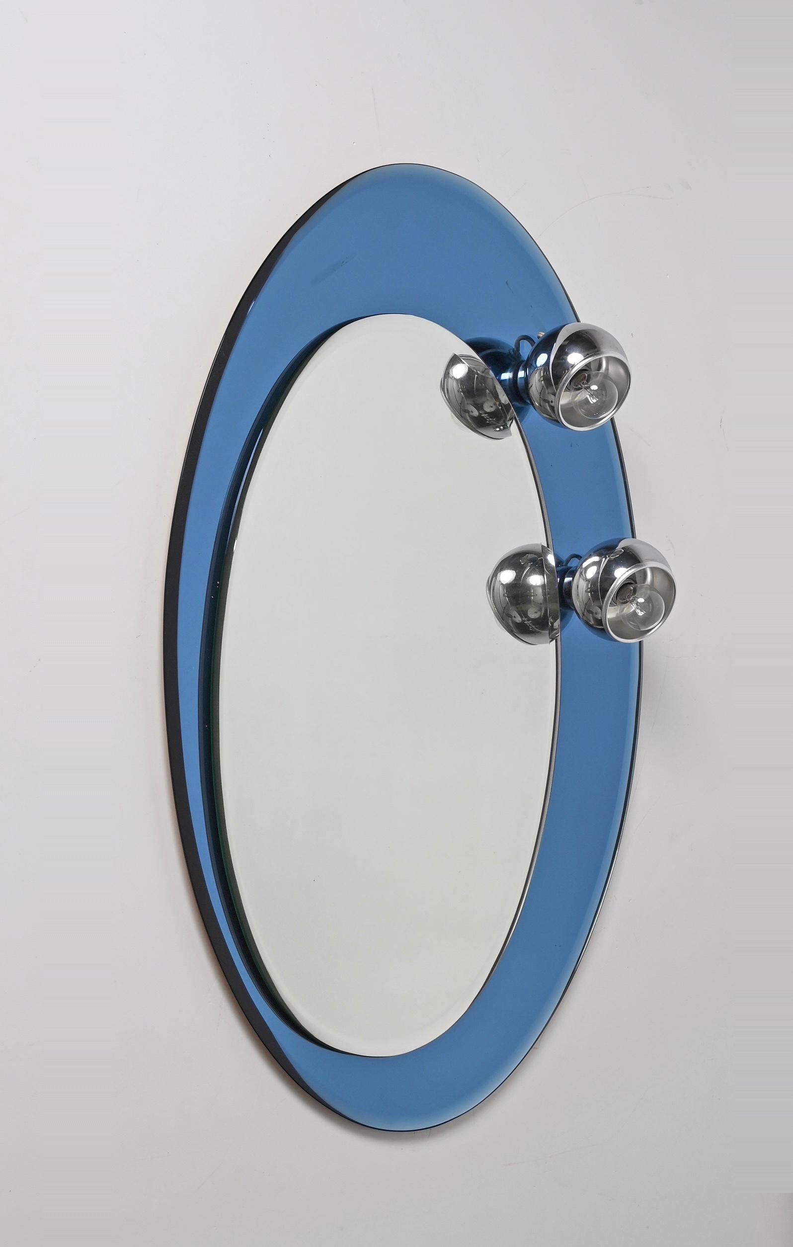 Midcentury Oval Wall Mirror with Blue Glass Frame and Magnetic Lights Italy 1960 For Sale 1