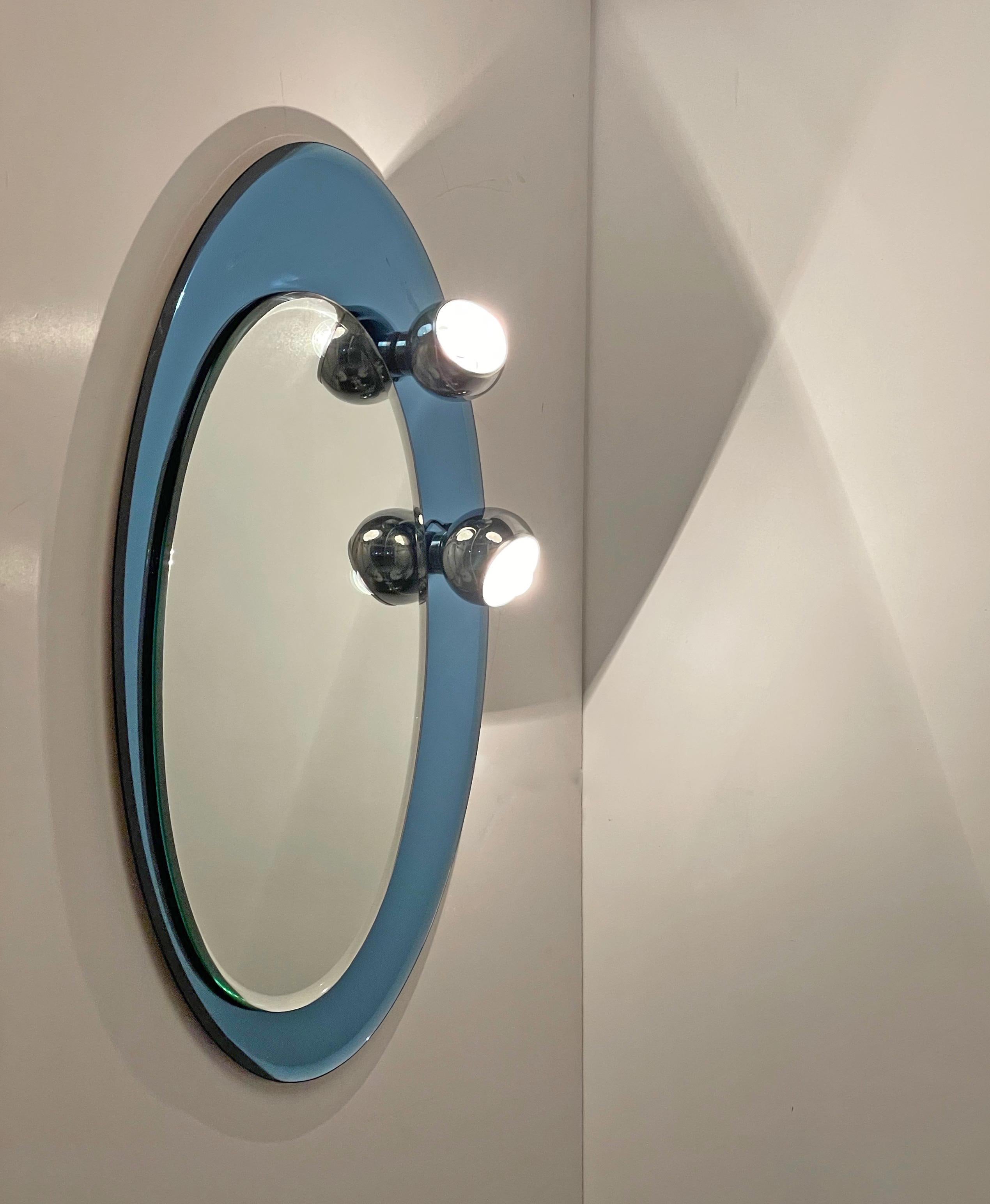 Midcentury Oval Wall Mirror with Blue Glass Frame and Magnetic Lights Italy 1960 For Sale 2