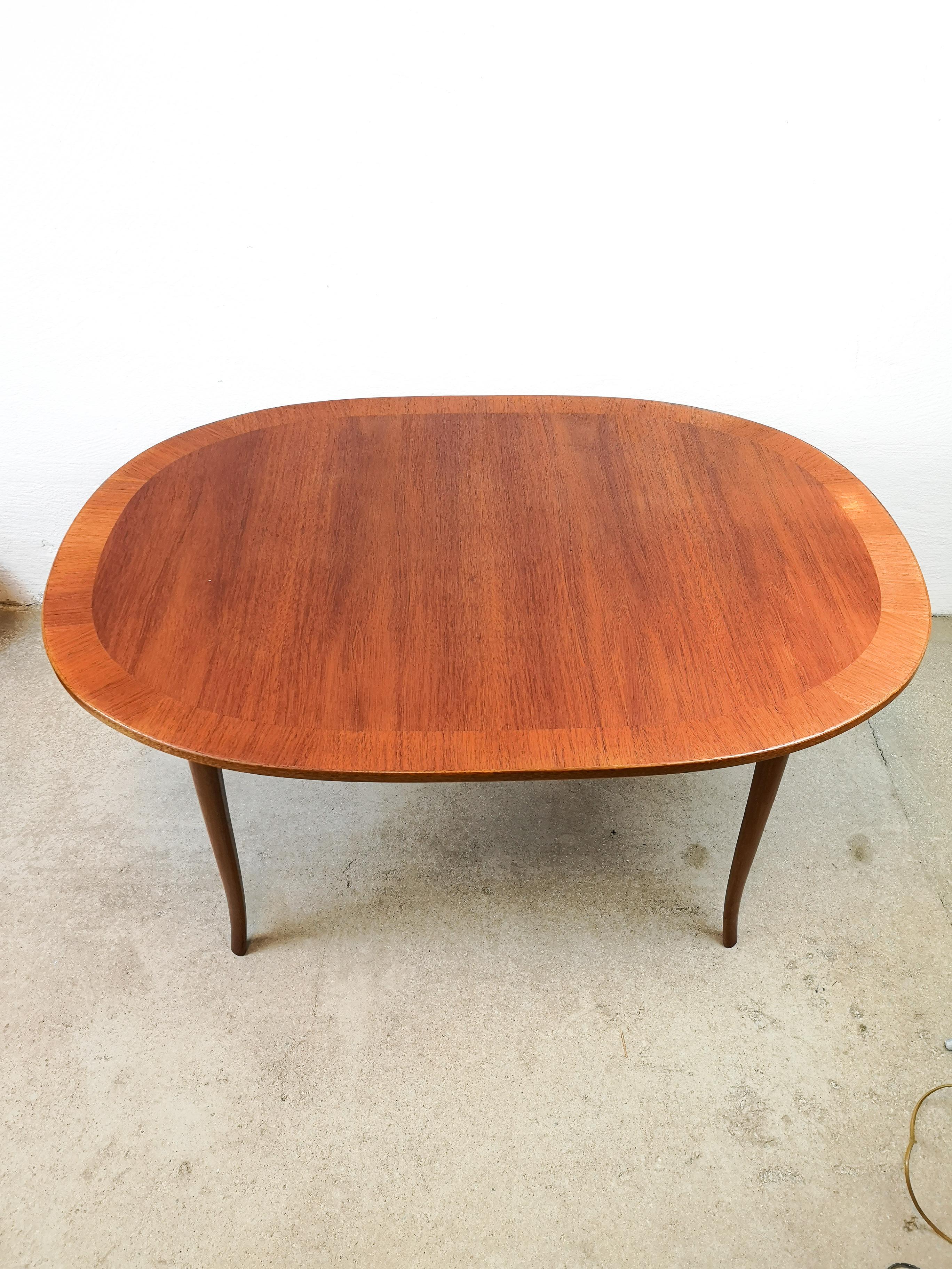 An oval teak coffee table of the model 
