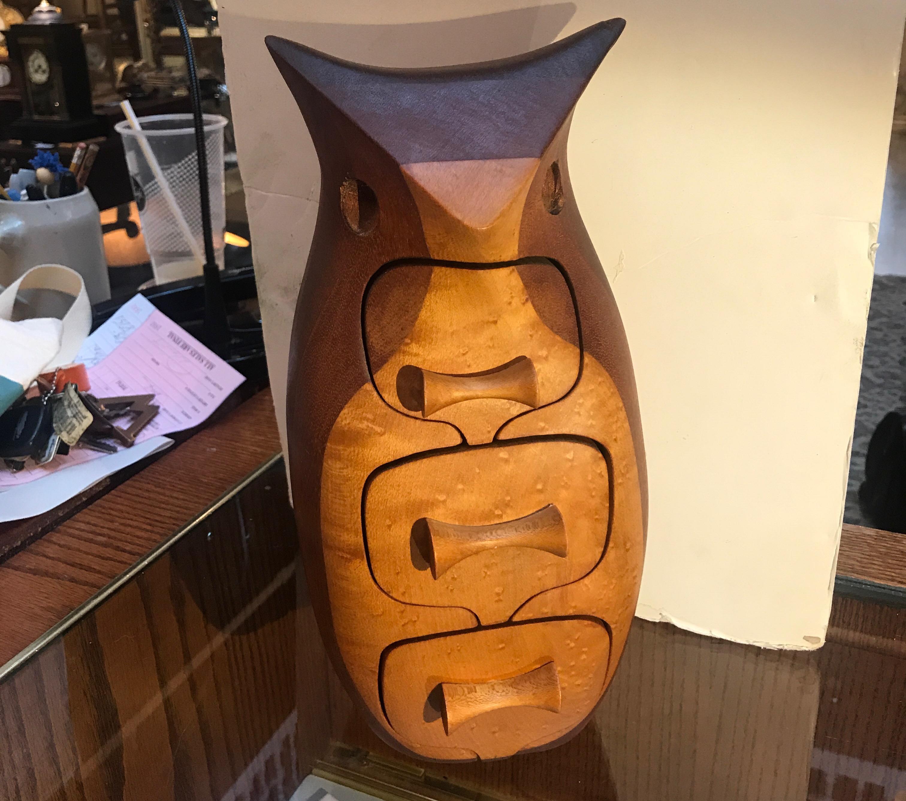 Bump is a Vermont-based wood sculptor best known for her stylized modernist wood jewelry boxes of various animal forms crafted in the 1970s and 1980s. 
This large owl box bump used burl maple in contrast and mahogany to create a dynamic visual