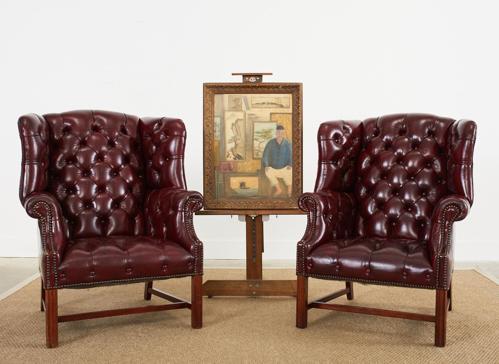 Interesting mid-century modern oil on canvas painting depicting an Asian artist seated in front of Asian paintings in his studio. The canvas measures 18 inches wide by 24 inches tall and is set in a carved wood frame. Signed on left bottom