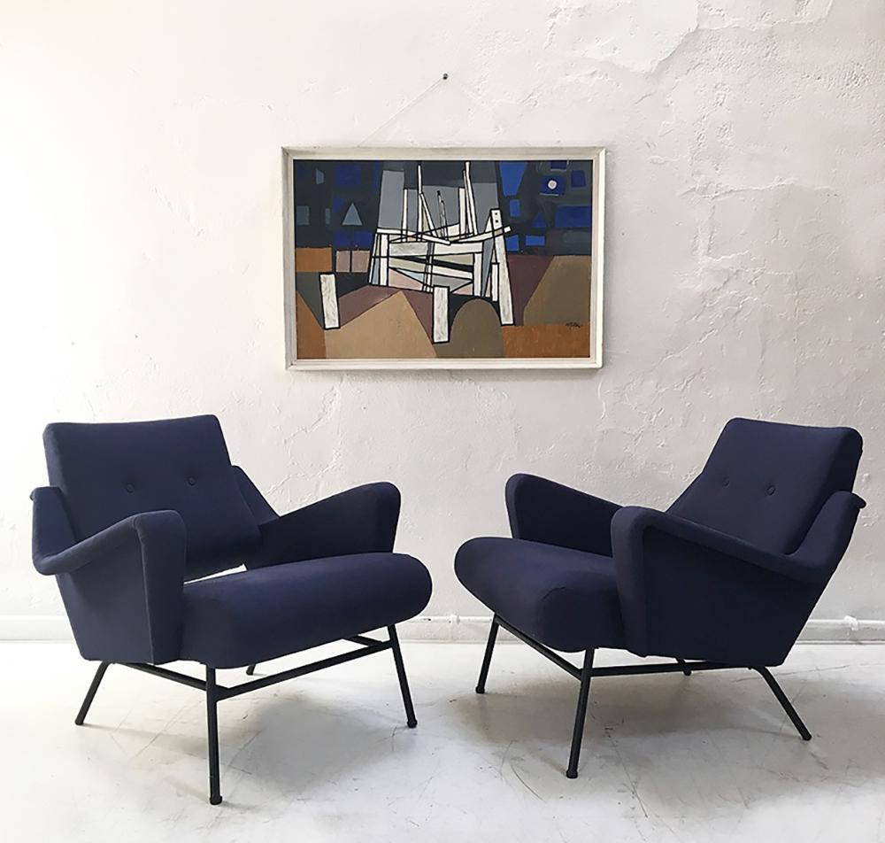 Rare pair of French 1950s Avant Garde lounge chairs designed by Gérard Guermonprez for Magnani. These super stylish midcentury chairs have a solid beech frame, standing on the original tubular steel frame. Extremely stylish, comfortable and in