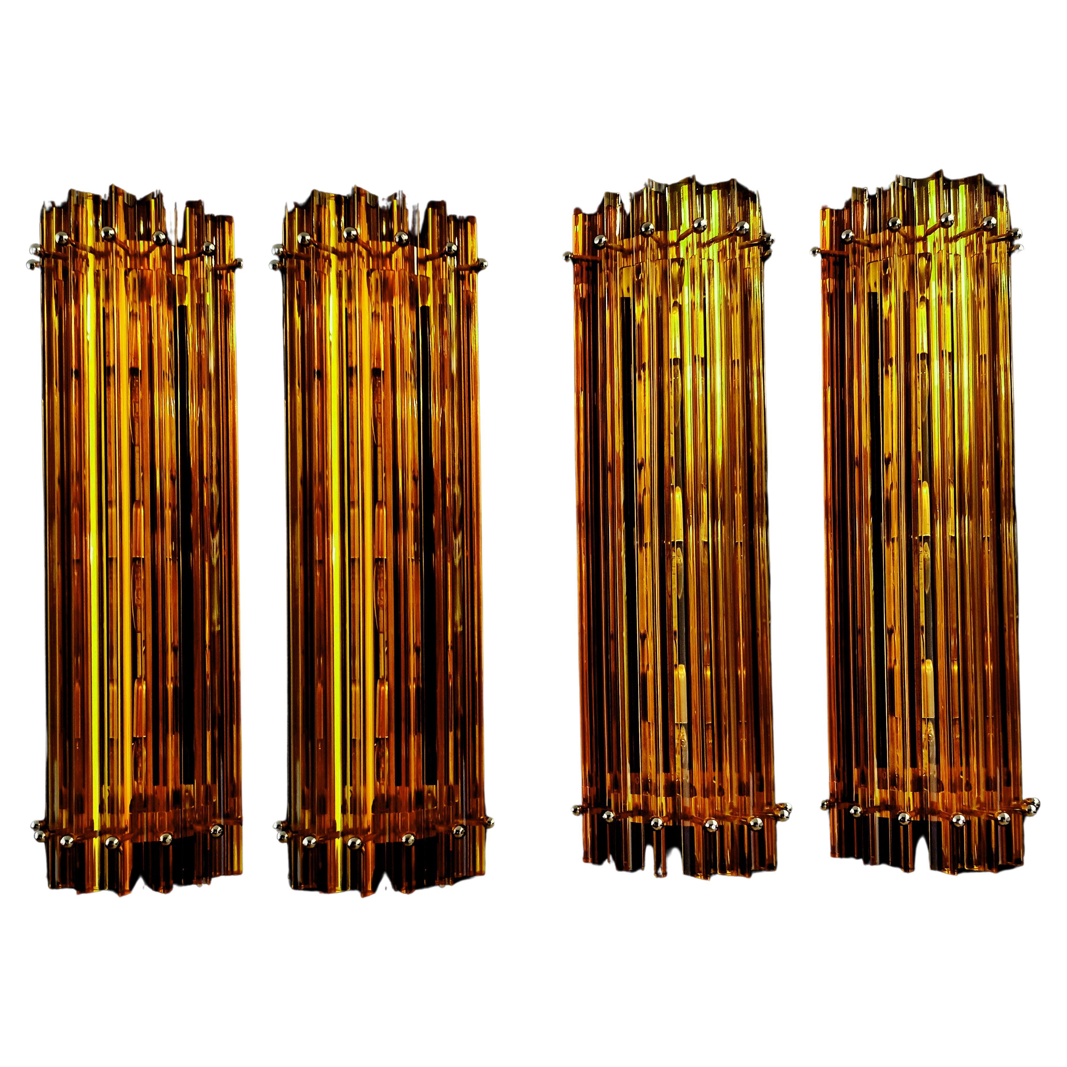 Pair Murano wall sconce, amber triedri, column Mariangela model
Fantastic Trio of vintage Murano wall sconce made by 6 Murano crystal prism (triedri) for each appliqué in a chrome metal frame. The shape of this sconce is column. The glasses are