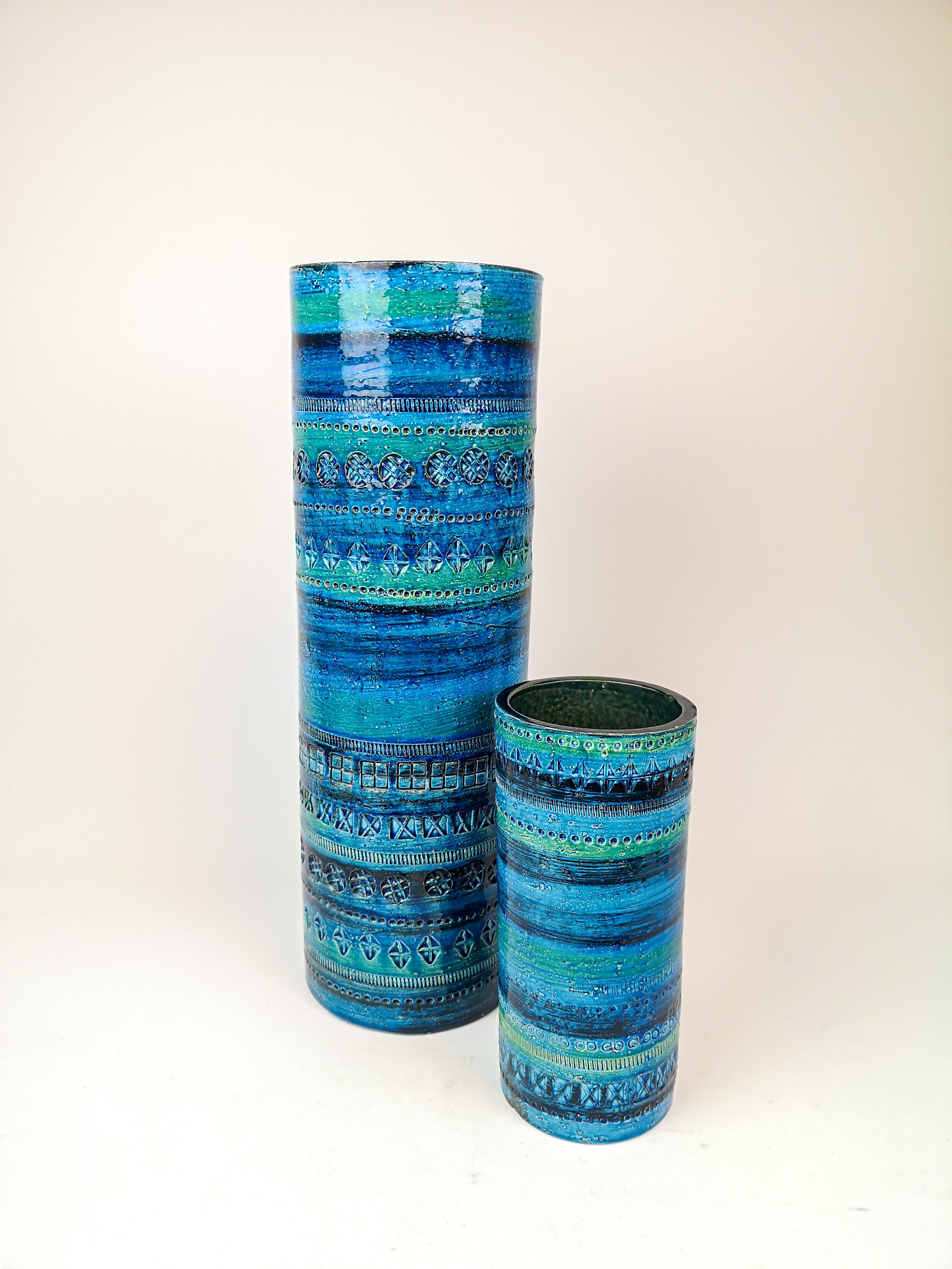 These magnificent vases are designed by Bitossi's artistic director Aldo Londi in 1950s. The large one is an extra-long piece. Together they work perfect.

The sinuous shape of these white clay pieces, finished with a vivid turquoise color, are