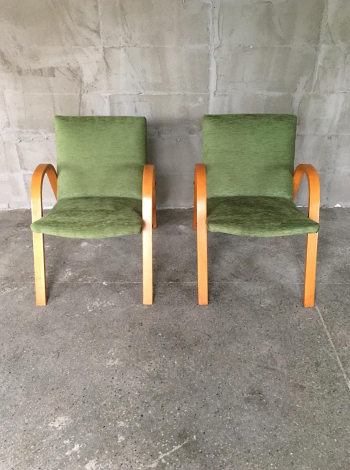 Very rare set of two bow wood armchairs by Hugues Steiner. Newly reupholstered in green fabric, bentwood. Really comfortable and light. Manufactured in Steiner.
 