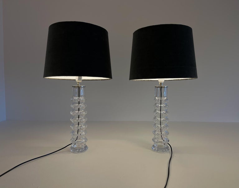 A nice pair of vintage table lamps designed by Carl Fagerlund for Orrefors, Sweden. Made in Crystal glass, with cuts in the glass. 
They are both signed in the bottom with Orrefors RD 207, circa 1970.

Nice condition, new wiring.

Dimensions: H
