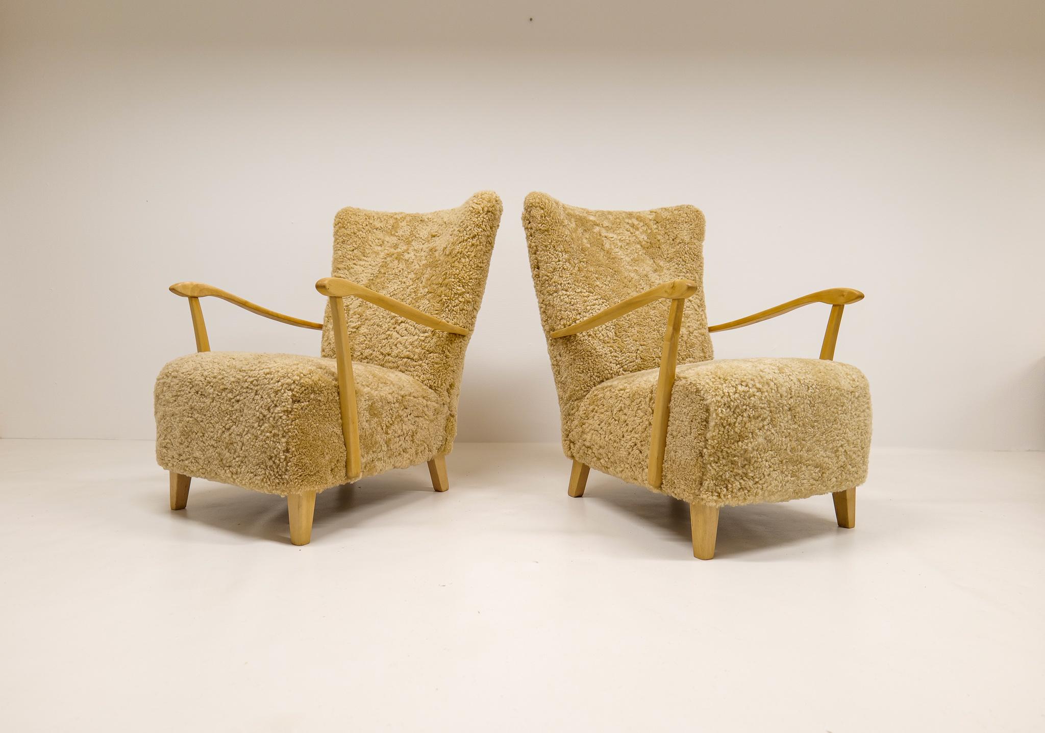 Swedish Midcentury Pair of Easy Chairs DUX in Sheepskin shearling, Sweden, 1950s