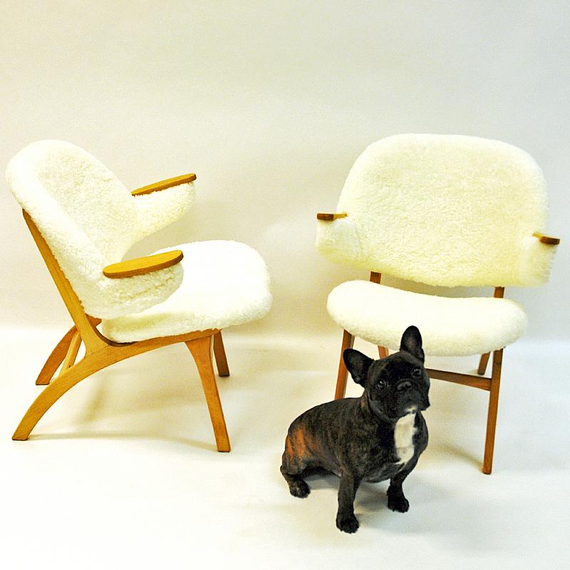White, lovely and fluffy!
These elegant easy chairs with new real white and soft sheepskin upholstery are designed by Sollide møbler in Norway 1950s. Birch legs and back. Very decorative in your home or holiday home and comfortable to sit in.