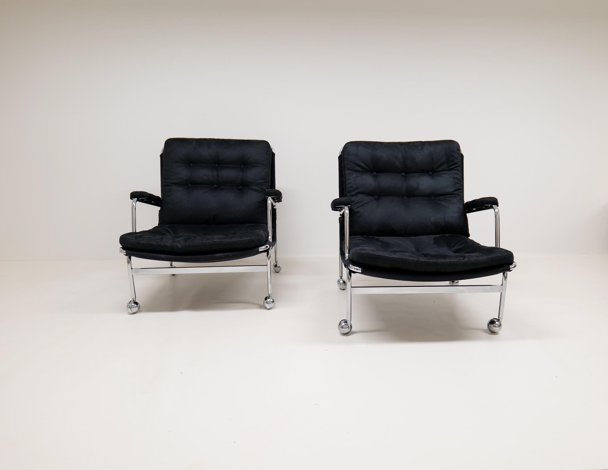 A pair of easy chairs made in 1969 at the Dux factory in Sweden and designed by famous Swedish designer Bruno Mathsson. These ones with tubular chromed steel with all new upholstery in suede. 

New upholstery, some wear on the chrome and on the
