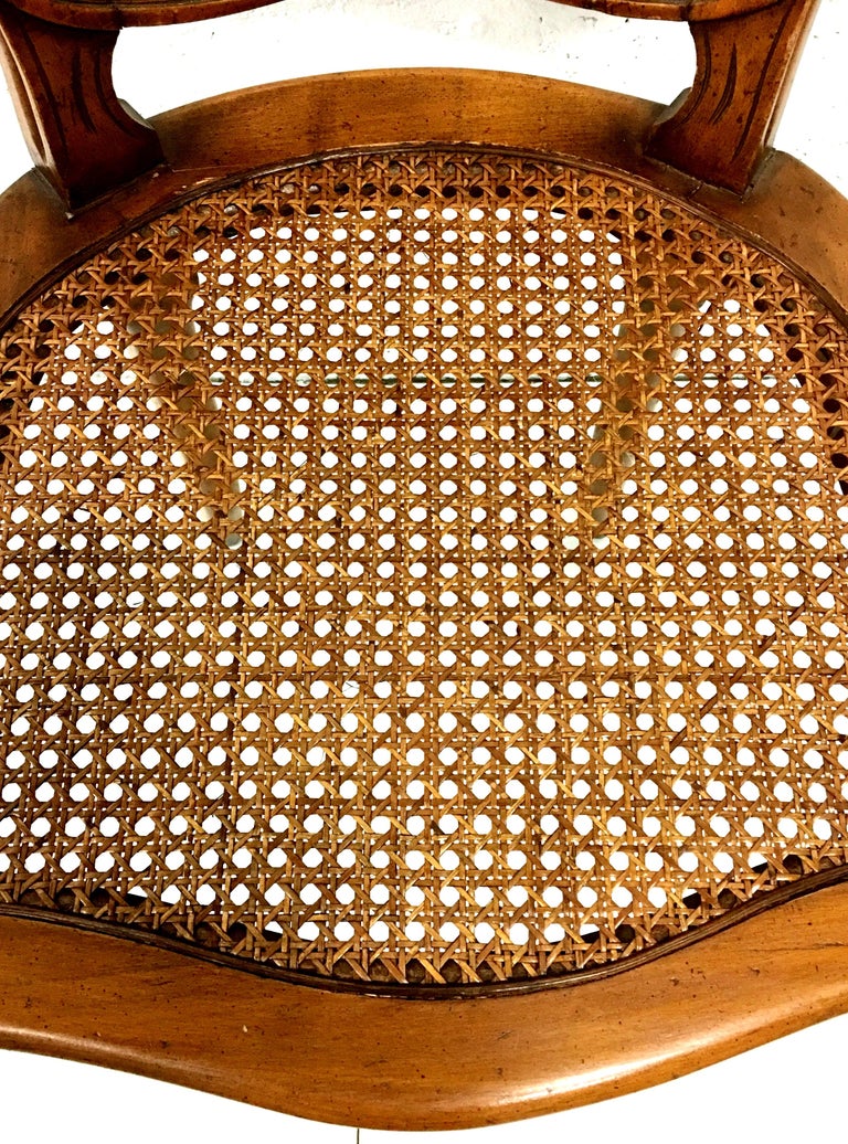 MidCentury Pair Of French Style Carved Wood and Cane Chairs For Sale