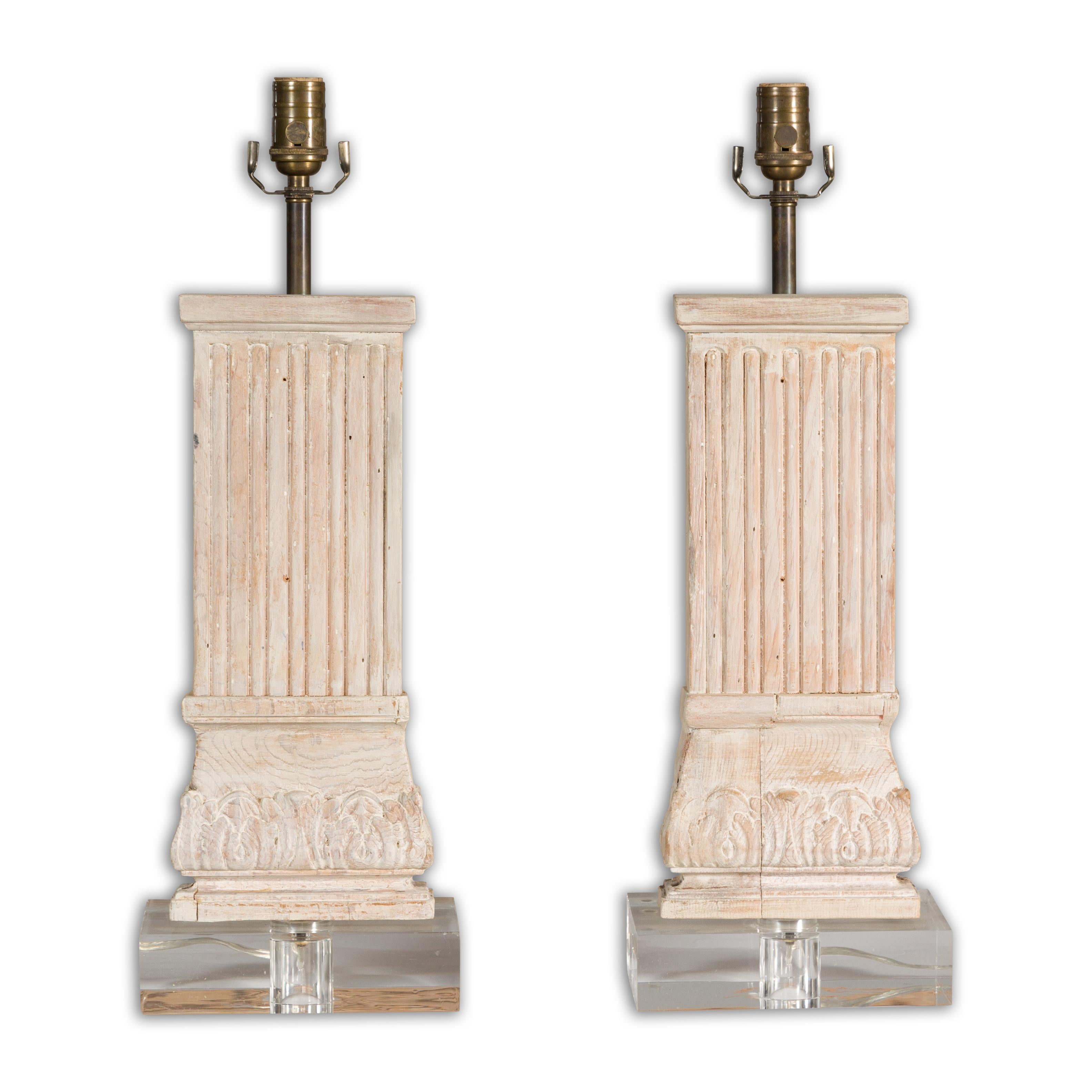 A pair of Italian Midcentury carved pine pilaster table lamps on lucite bases, US wired. Introducing a striking pair of Italian Midcentury carved pine pilaster table lamps, bringing the architectural grandeur to your living space. Crafted in the