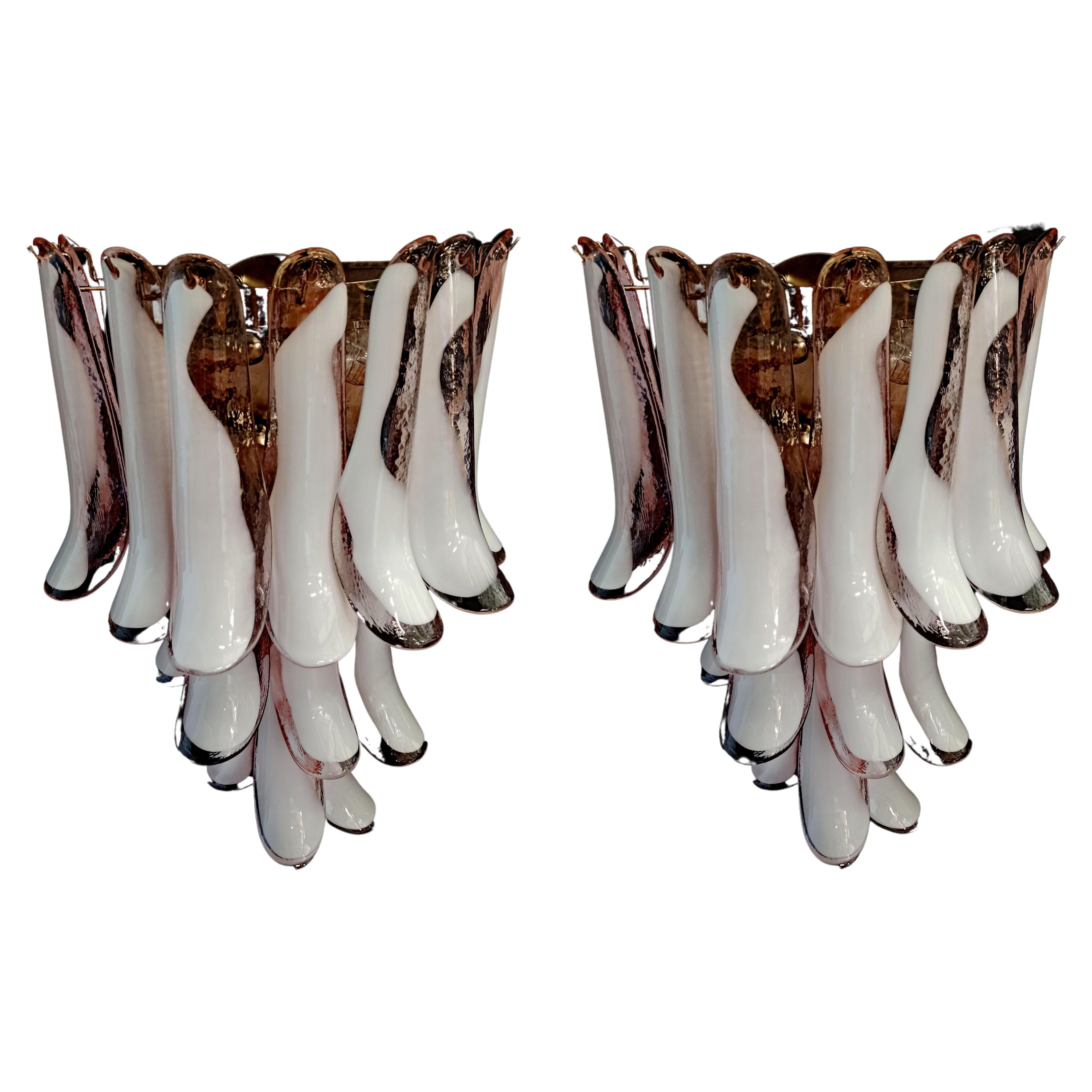 Pair of italian Murano wall sconces. Wall lights have 16 pink and white“lattimo” glasses (for each applique) in a nickel-plated metal frame. Decorative object of great importance.
Period: late XX century
Dimensions: 27,90 inches (72 cm) height;