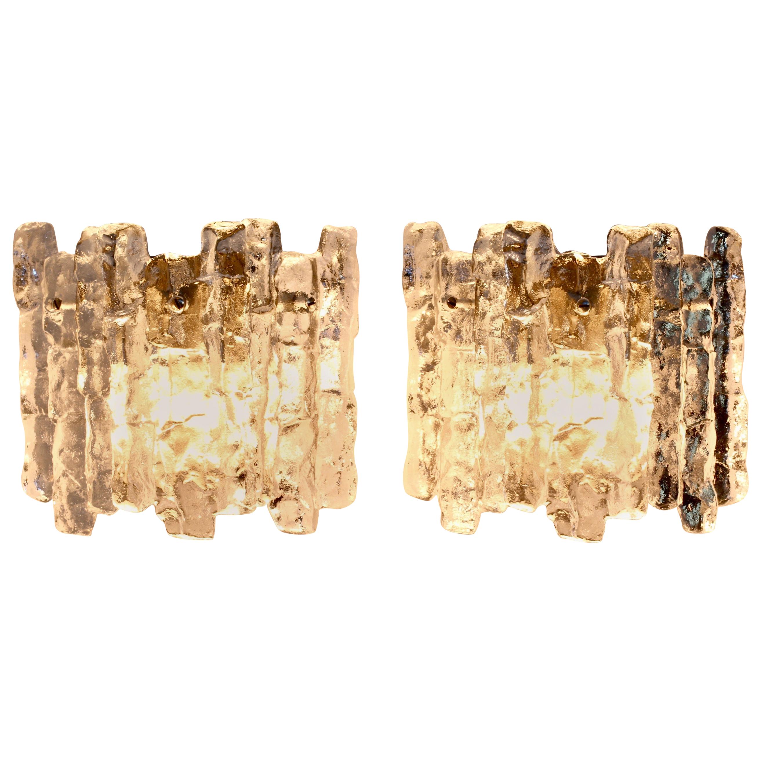 Pair of midcentury Austrian made ice glass wall sconces by Kalmar, circa 1965. Featuring three hanging glass elements resembling melting ice crystals suspended from a nickel coloured mount or bracket.

Can be used with original pull switch (not